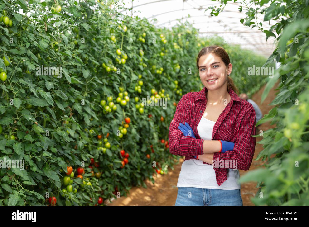 Girl in a greenhouse Stock Photo - Alamy