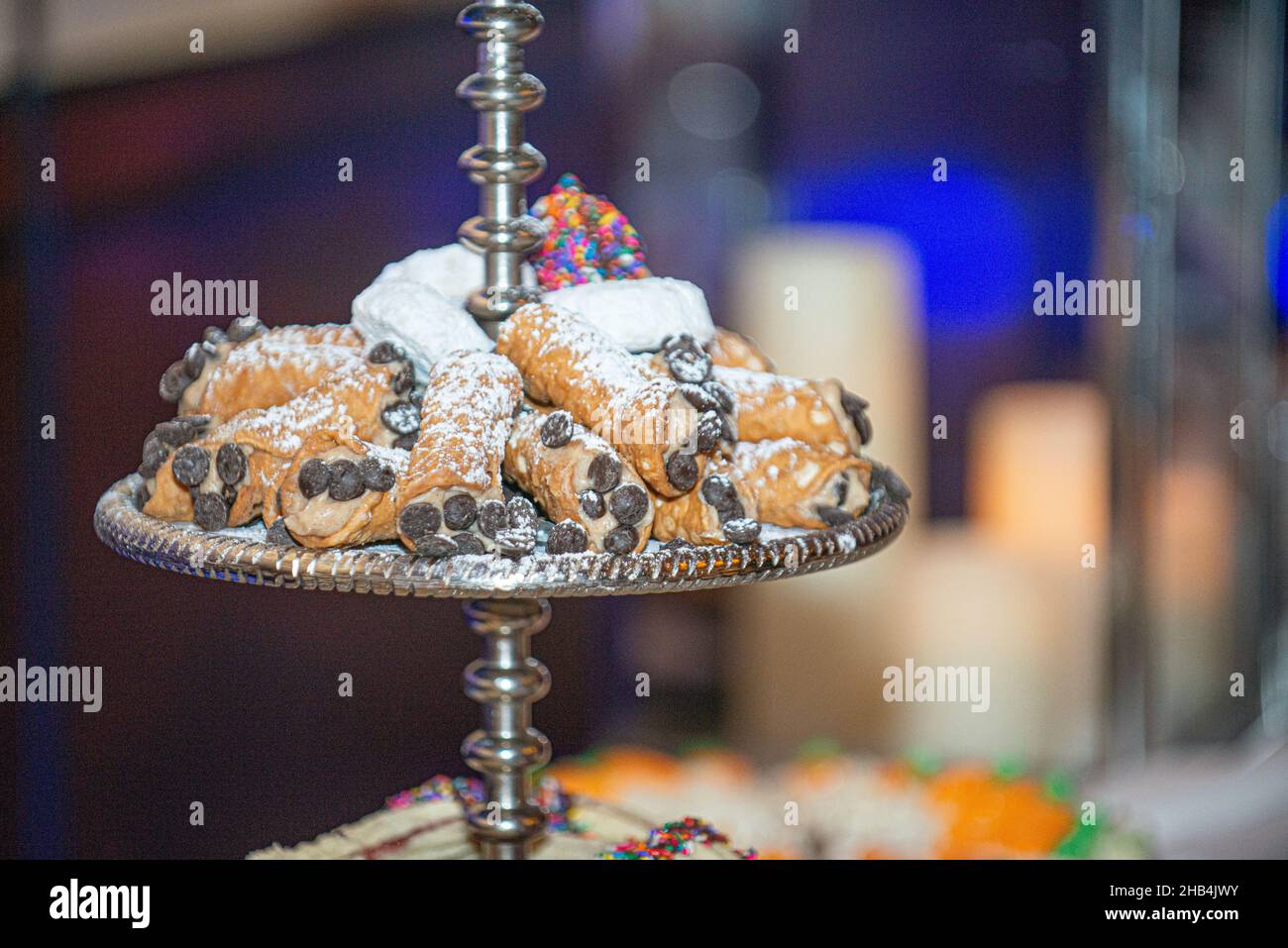 Cannoli siciliani pastry tray on dessert bar at traditional italian wedding Stock Photo