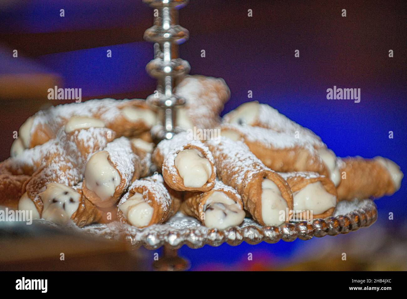Cannoli siciliani pastry tray on dessert bar at traditional italian wedding Stock Photo