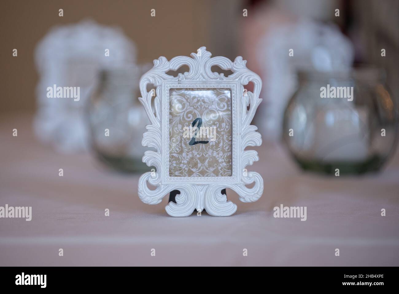 Ornate white picture frame place setting number two Stock Photo Alamy
