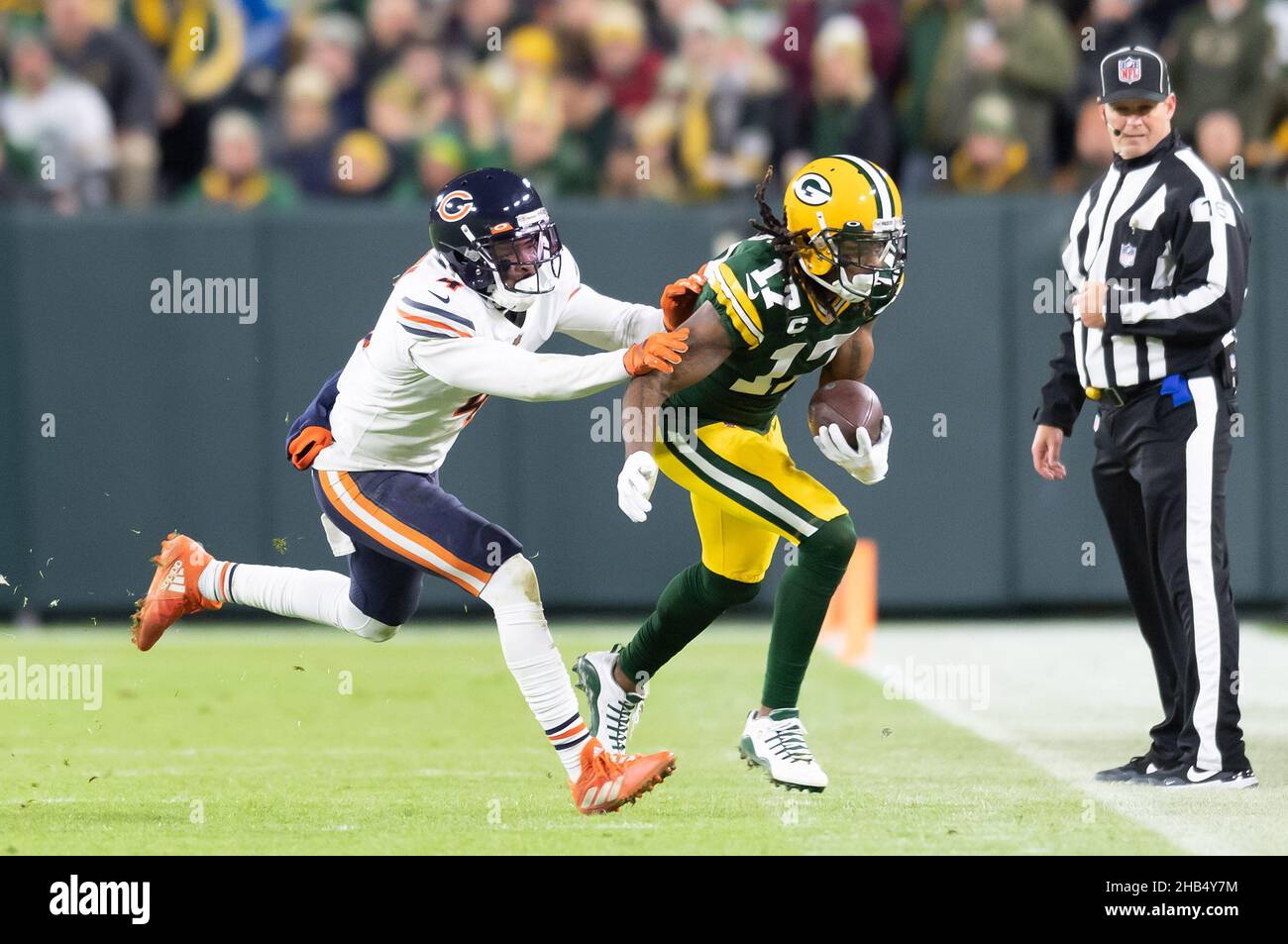 Green Bay, Wisconsin, USA. 12th Dec, 2021. Green Bay Packers wide receiver Davante Adams #17 is pushed out of bounds after making a catch by Chicago Bears free safety Eddie Jackson #4 during NFL football game between the Chicago Bears and the Green Bay Packers at Lambeau Field in Green Bay, Wisconsin. Packers defeated Bears 45-30. Kirsten Schmitt/CSM/Alamy Live News Stock Photo