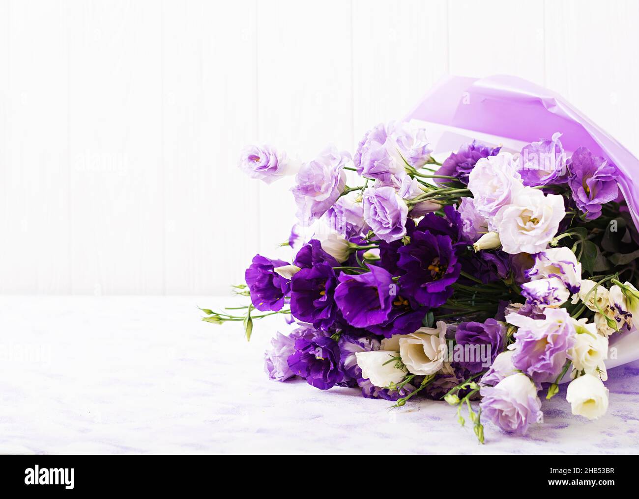 Beautiful flowers bouquet mix of white, purple and violet eustoma. Stock Photo