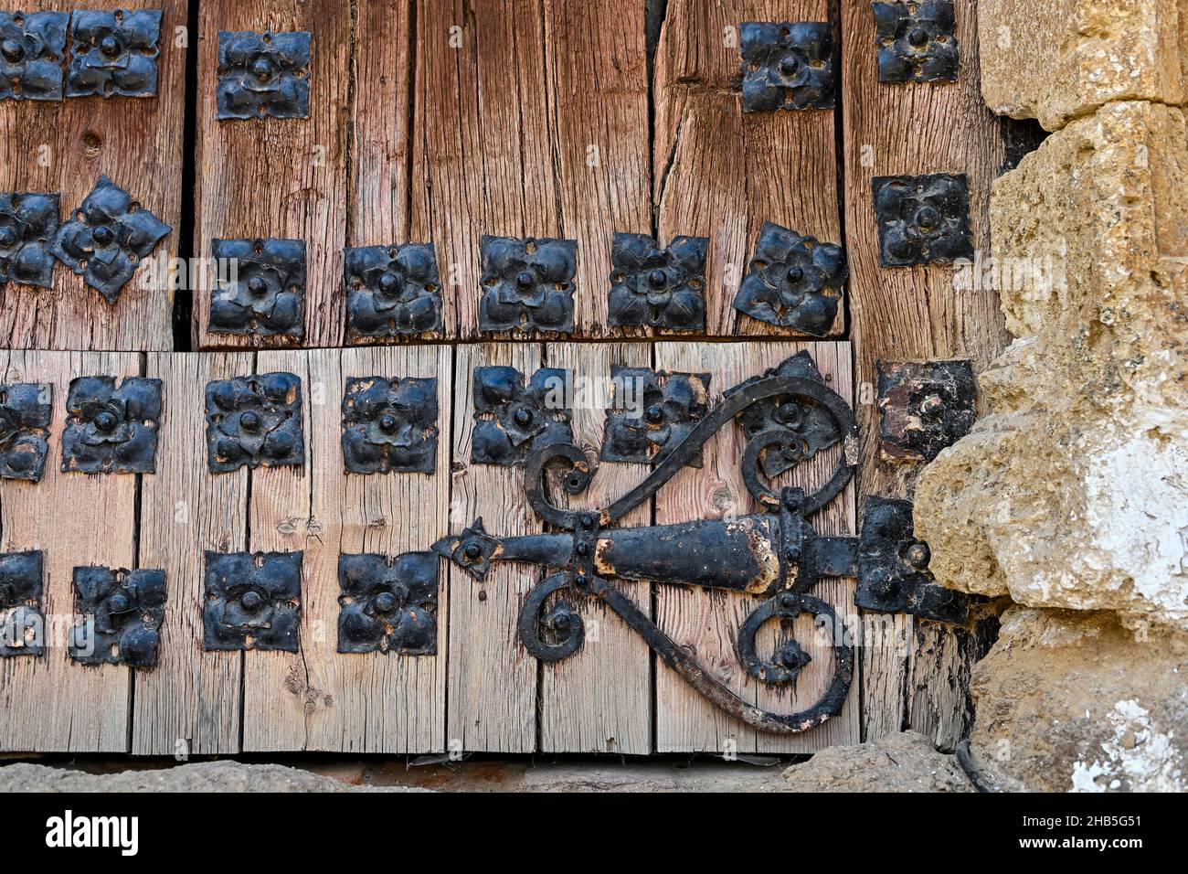 Anchors and metal ornaments of an old gate. Stock Photo