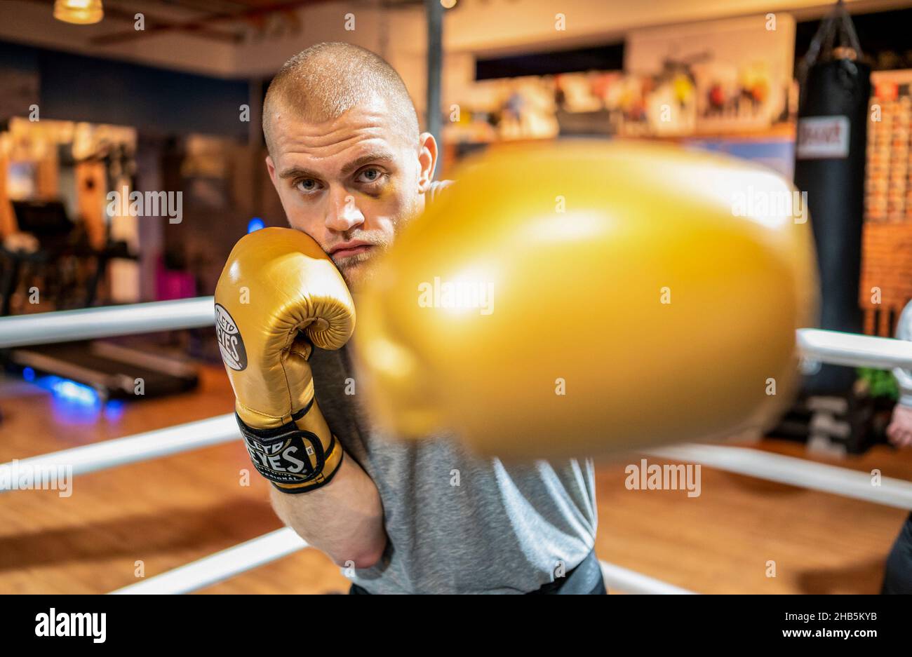 Bispingen, Germany. 13th Dec, 2021. The boxer Joscha Blin is in the ring. The grandfather of Joscha Blin, Jürgen Blin, boxed against the boxing legend Muhammad Ali, 50 years later the 24-year-old is now facing his first professional fight. (to dpa 'Grandson of Ali opponent before boxing debut: 'Plenty of power in his fists'') Credit: Philipp Schulze/dpa/Alamy Live News Stock Photo