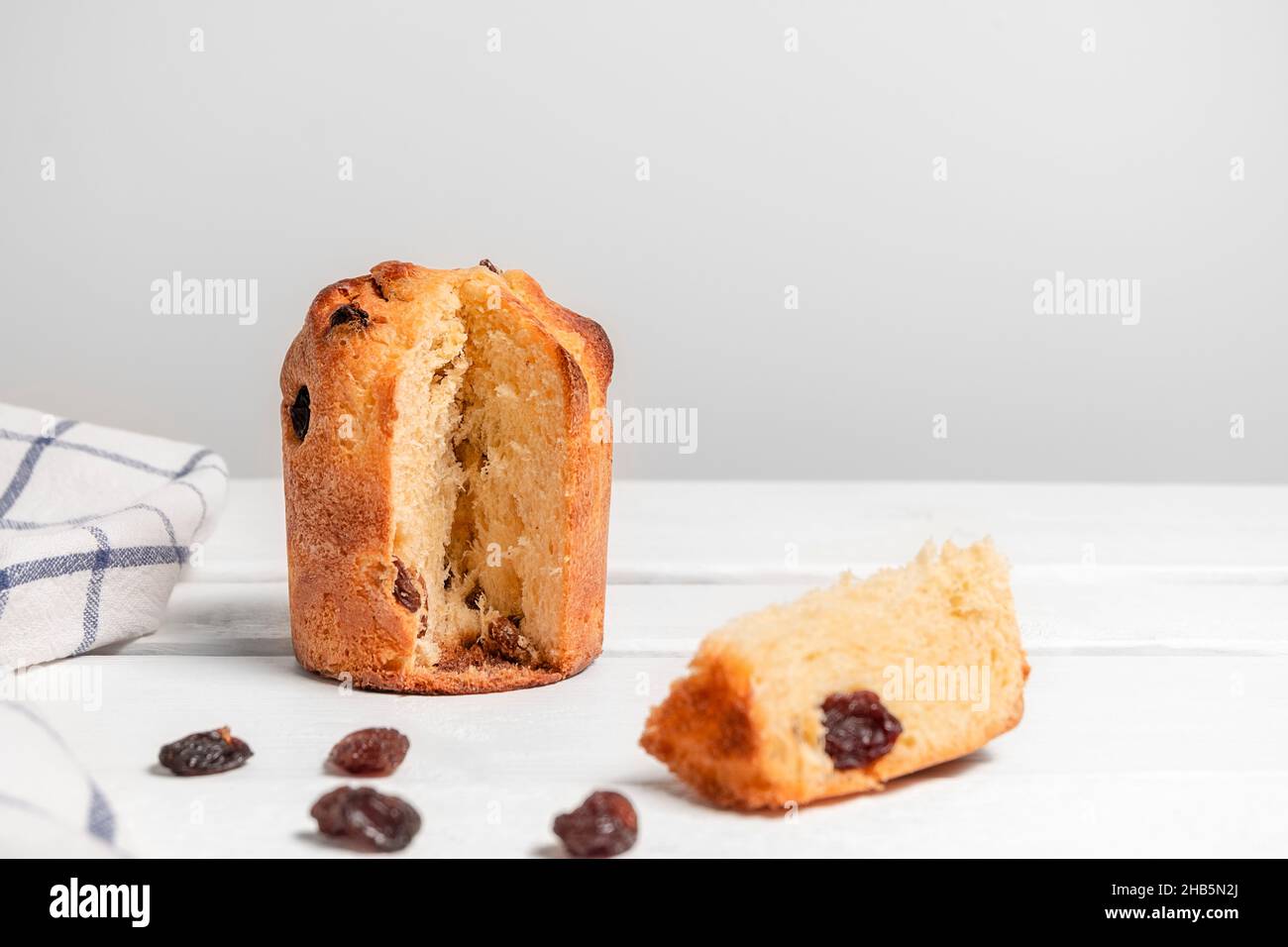 Panettone, traditional italian christmas cake on white wooden table with copy space Stock Photo