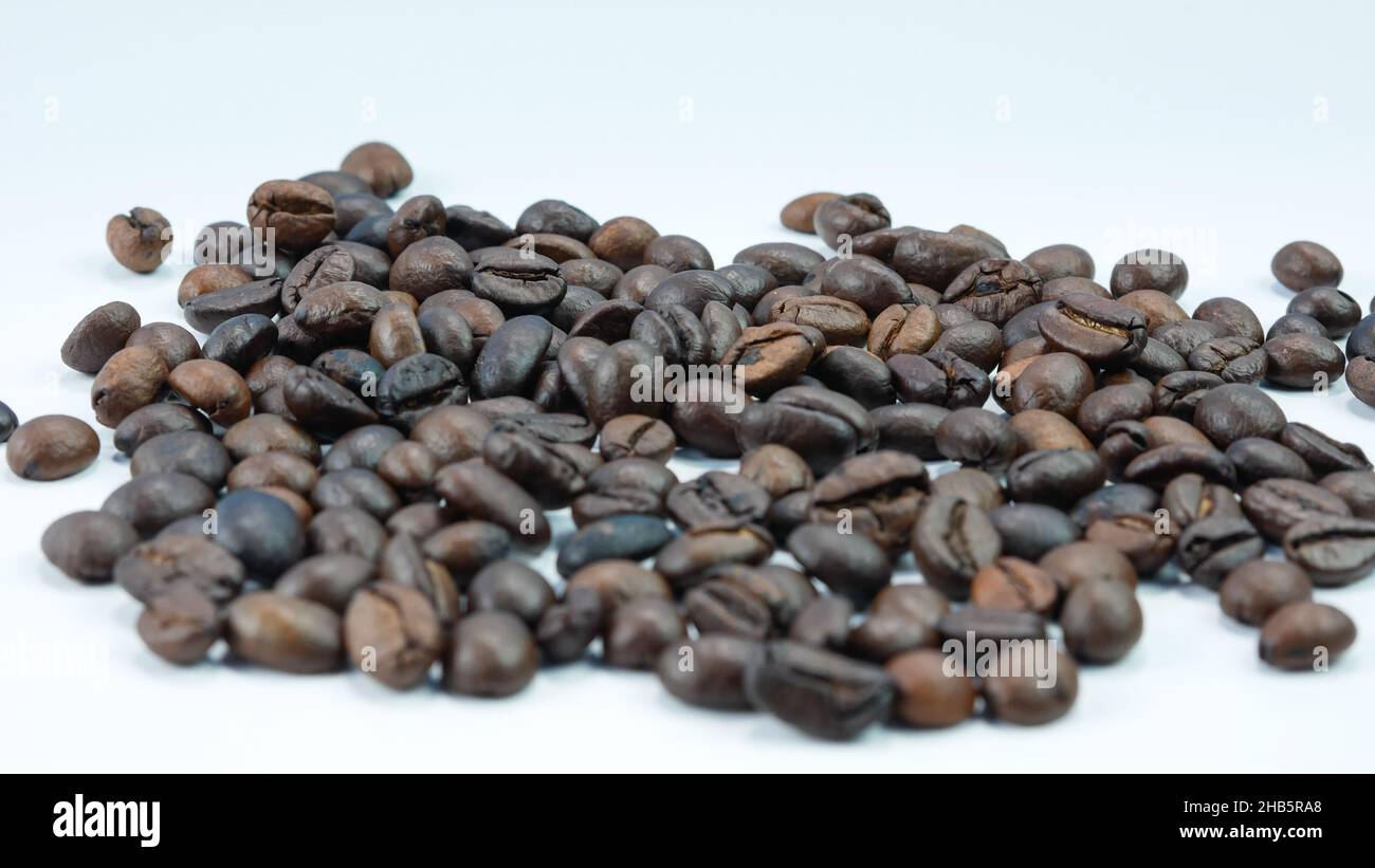 roasted coffee beans isolated on a white background Stock Photo - Alamy