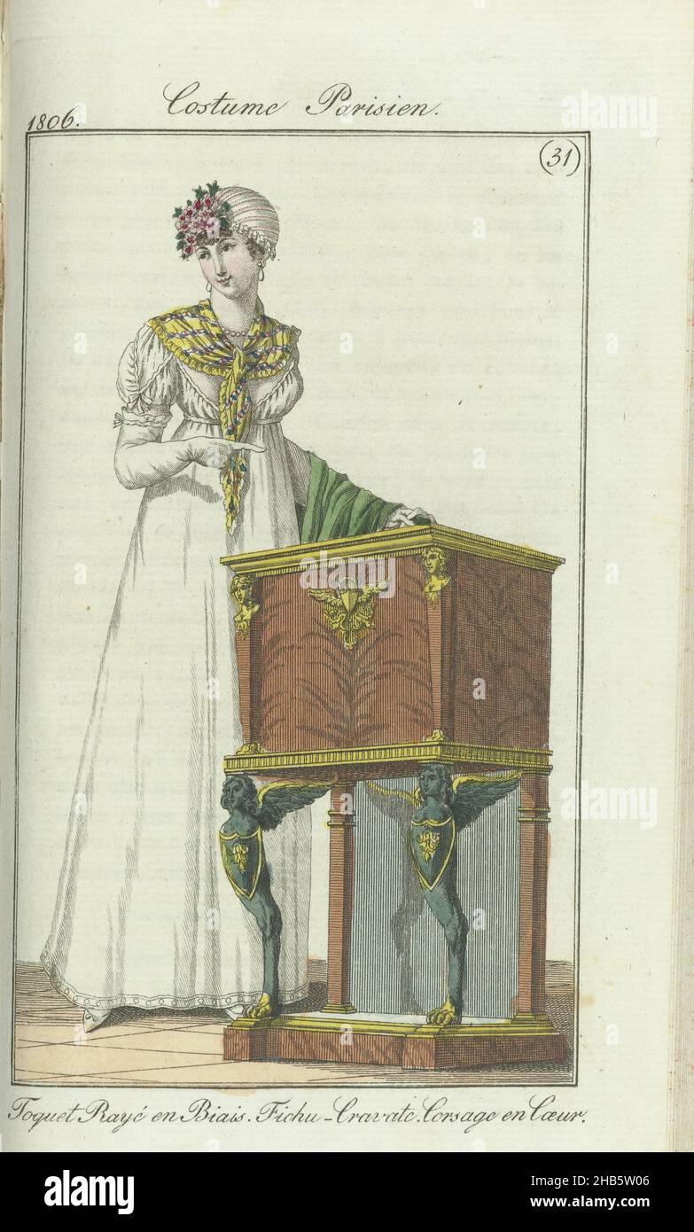 Journal des Dames et des Modes, edition Frankfurt 28 juillet 1806, Costume Parisien (31): Toquet Rayé en Biais. Fichu-Cravate. Corsage en Coeur., Woman at chifonnier (described as a new type of furniture) The accompanying text (p. 133) states: Toque of oblique striped fabric with tuft of flowers on the front. Necklace and earrings of pearls. Fichu-cravatte around the neck. Gown of white muslin. Corsage and coeur. Short puff sleeves. Scarf of embroidered green silk. White gloves. White shoes. The print is part of the fashion magazine Journal des Dames et des Modes, published in Frankfurt as a Stock Photo