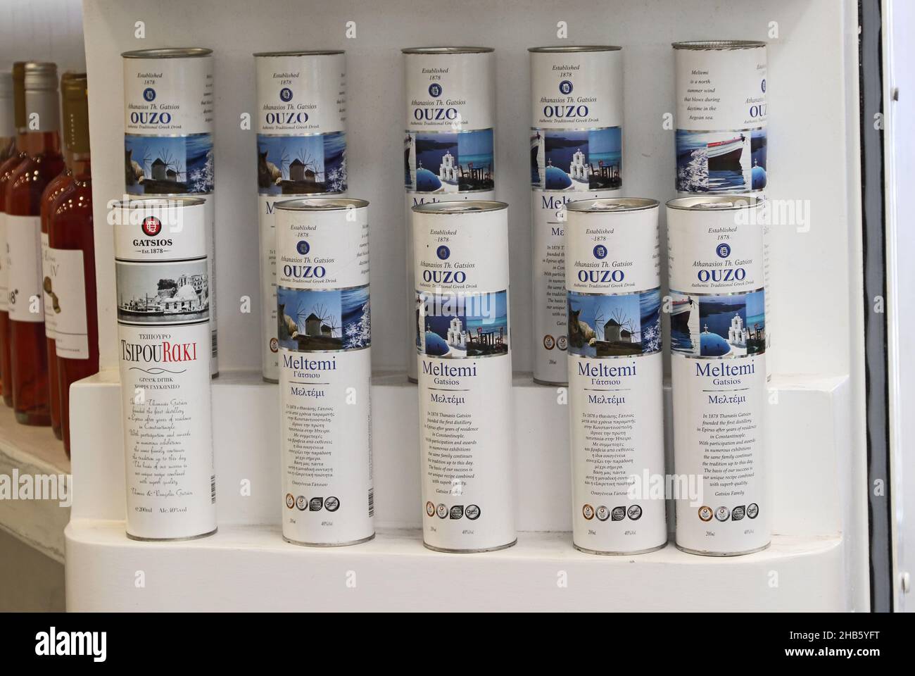 Packaged bottles of Ouzo and Tsipou Rali produced by Thanasis Gatsios on sale, Fira, Santorini, Greece Stock Photo