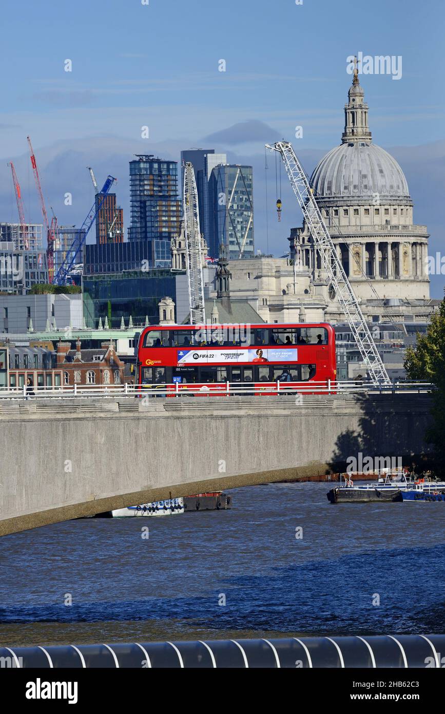 London, England, UK. View of St Paul's Cathedral, the River Thames and a bus crossing Waterloo Bridge, seen from the Golden Jubilee Bridge Stock Photo