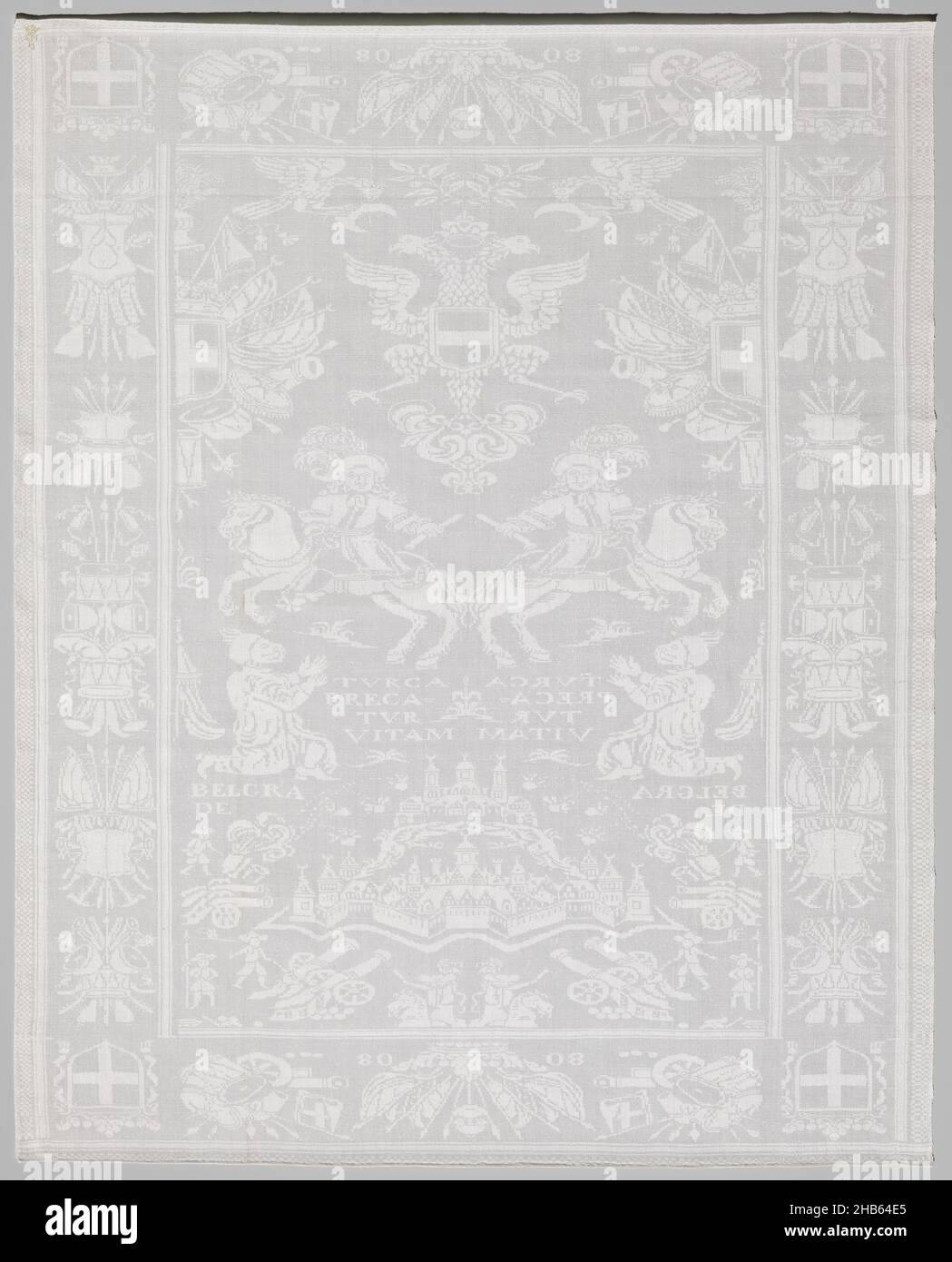 Linen damask napkin with a historical scene, White linen damask napkin with the conquest of Belgrade from the Turks by Eugenius of Savoy. Marked E M 13 under a crown. The field has a mirrored pattern with from bottom to top: men at cannons, a city with inscription BELGRADE, a kneeling man with inscription: TVRCA PRECA TVR VITAM, a horseman and two half arms. The edges have crest trophies and in the corners a coat of arms., Vlaanderen (possibly), 1717, linen (material), damask, height 112.0 cm × width 87.0 cm Stock Photo