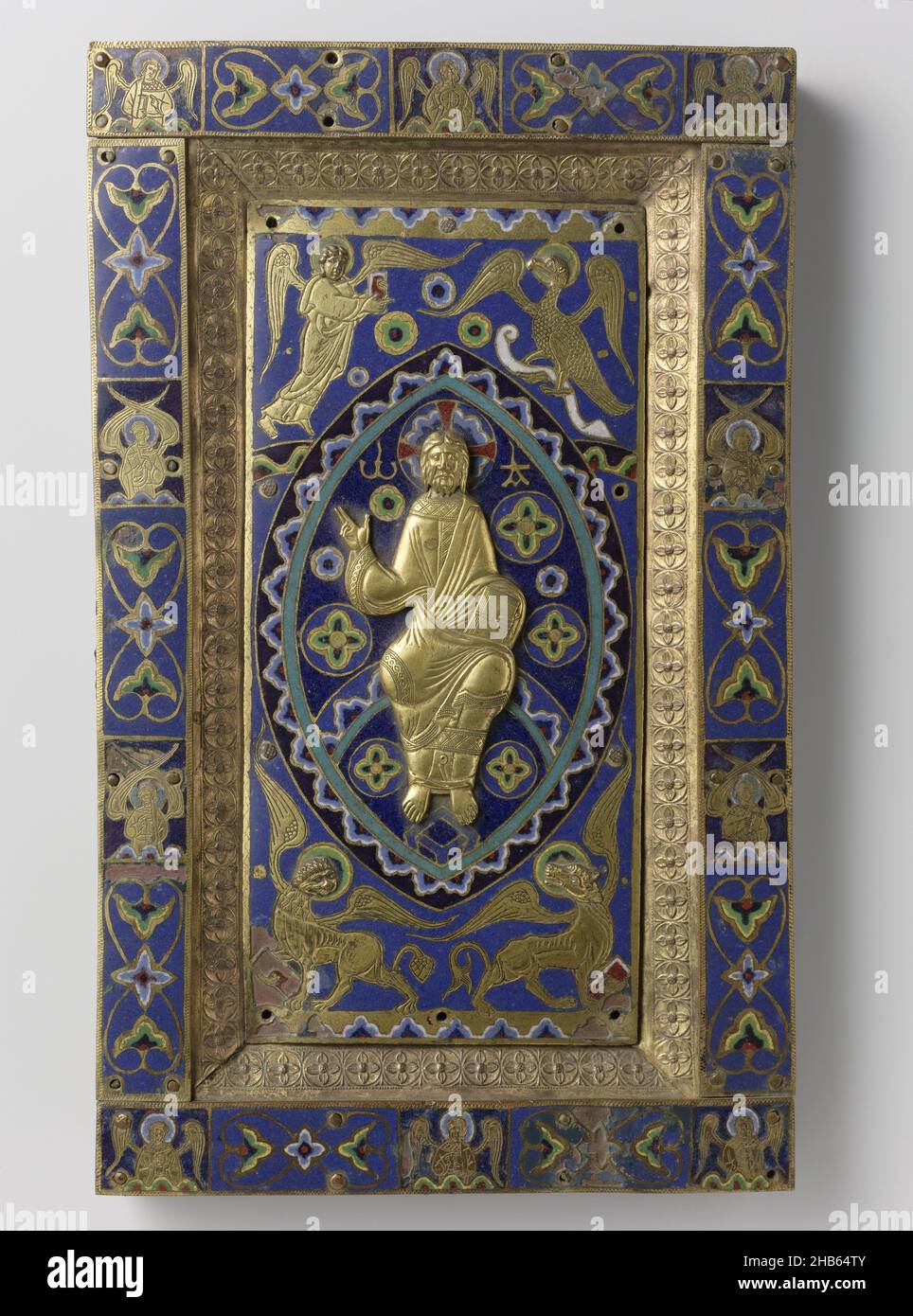 Back cover of an Evangeliary with a Salvator mundi (Blessing Christ), Back cover of a gospel book decorated with the blessing Christ, Back cover of a gospel book of gilt copper and enamel champlevé. In the center field, on blue ground with scattered stars in a mandorla, the blessing Christ is depicted in relief; in the corners, the four Evangelists' syllables; on the edge, alternating semi-figures of angels and tendrils, on a blue ground of émail, anonymous, Limoges, c. 1200 - c. 1250, copper (metal), gilding, height 32.1 cm × width 19.7 cm × thickness 2.8 cm Stock Photo