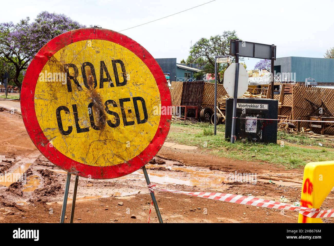 Road in construction and 'Road Closed' sign in Lydenburg, South Africa Stock Photo
