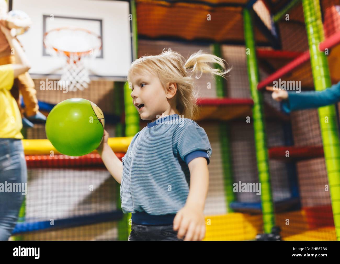 Happy children playing a kids basketball game. Elementary age boys play