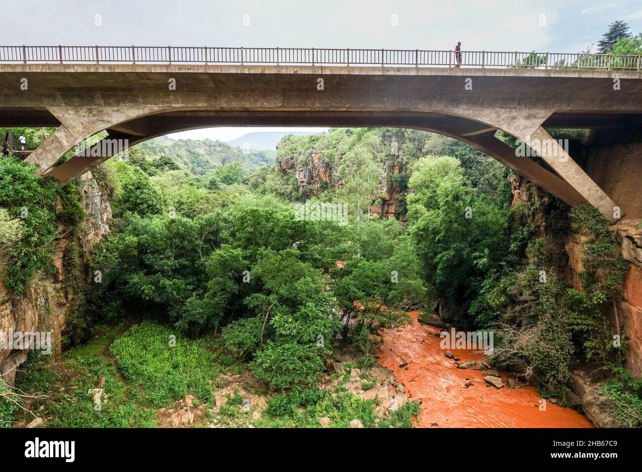 Sabie falls with orange water under the bridge of Sabie, Mpumalanga