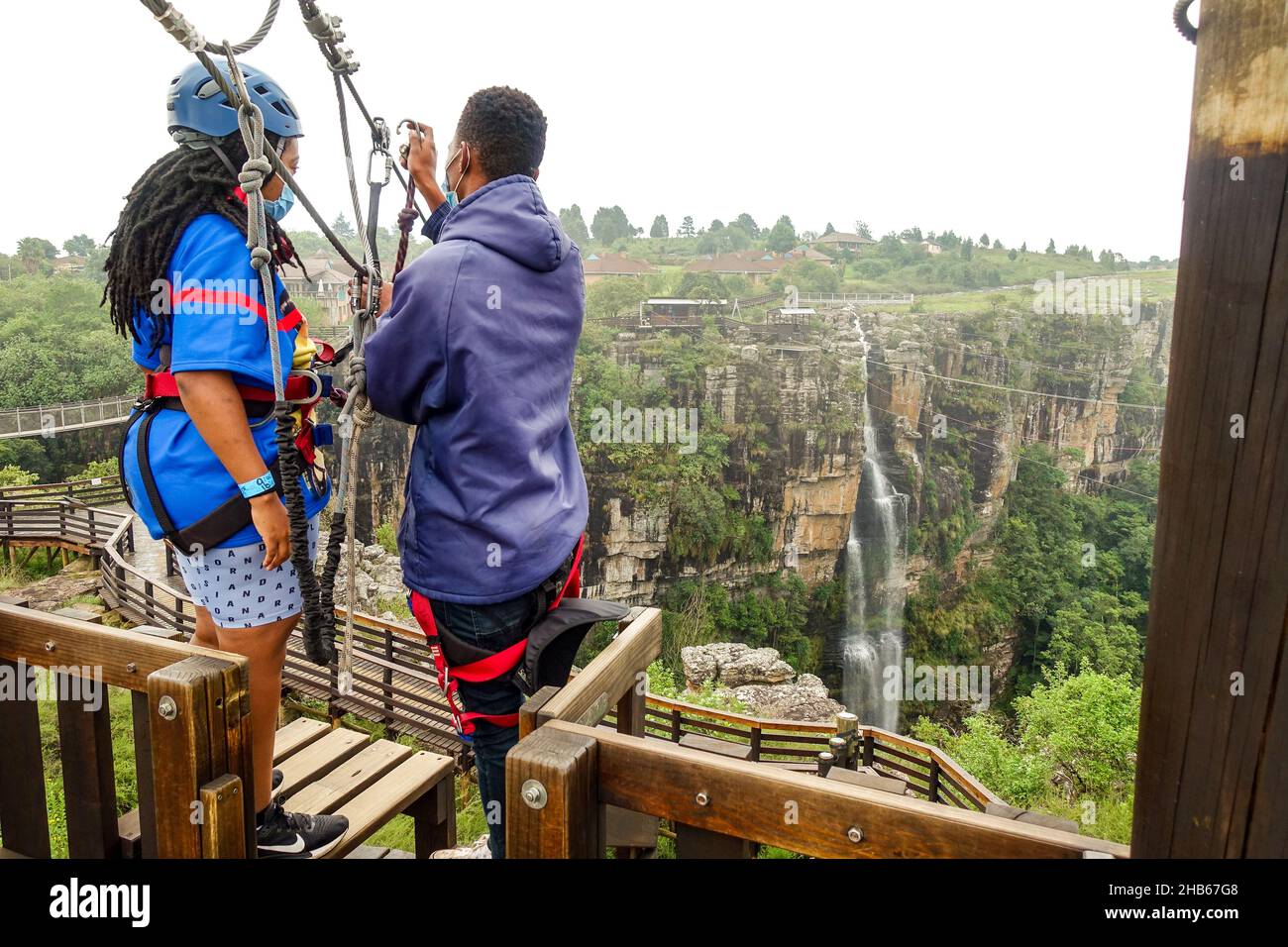 Black woman about to glide along a zipline at Graskop gorge, South Africa Stock Photo