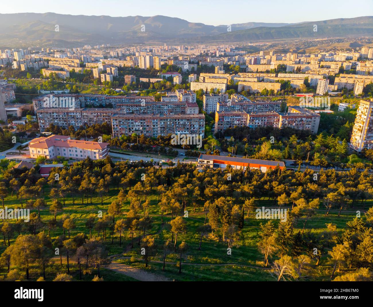 Mtskheta-Mtianeti district buildings with park in the foreground and mountains in the background. Soviet union style living property.3 2020 Stock Photo