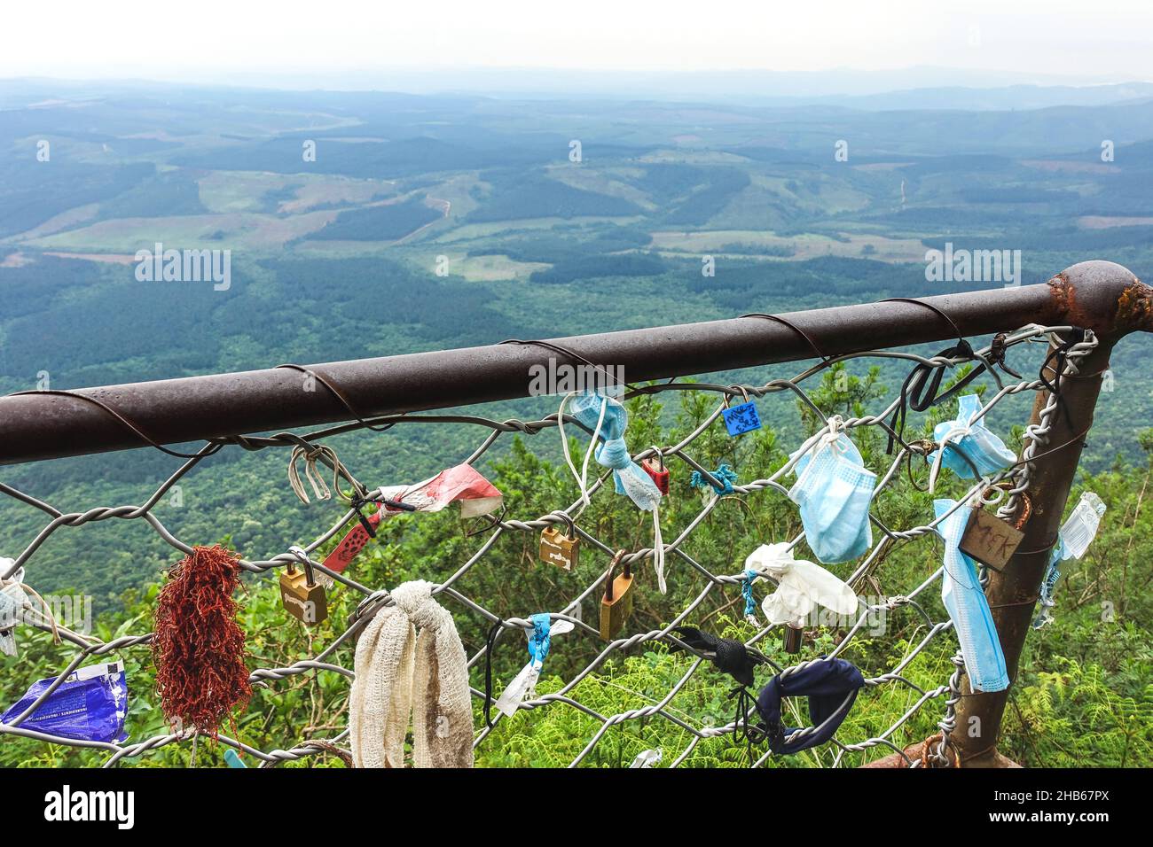 Traveling during the COVID19 pandemic: Locks and face masks on the fence at God's Window viewpoint alongside the panorama route, South Africa Stock Photo