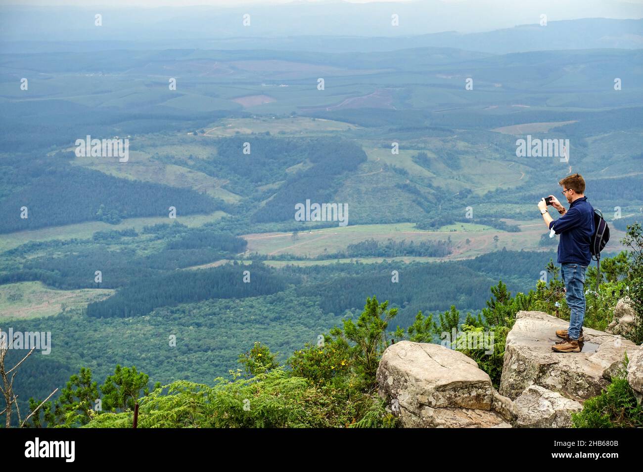 Visitors taking panoramic photos at God's Window viewpoint alongside the panorama route, Mpumalanga, South Africa Stock Photo