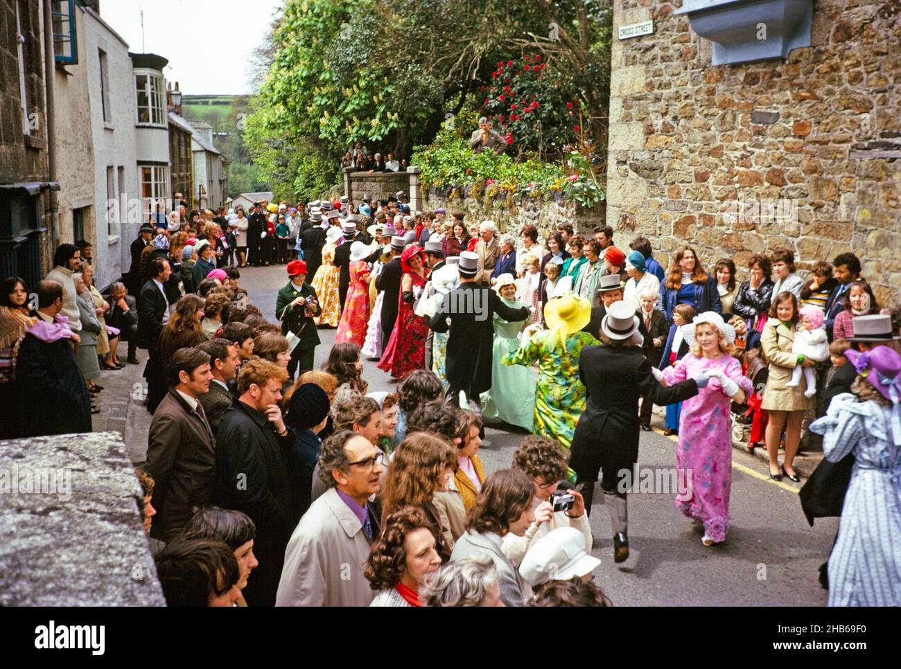 Flora Day, Helston, Cornwall, England, UK 1973 - crowds watch couples perform the  Furry dance in the streets of the town Stock Photo