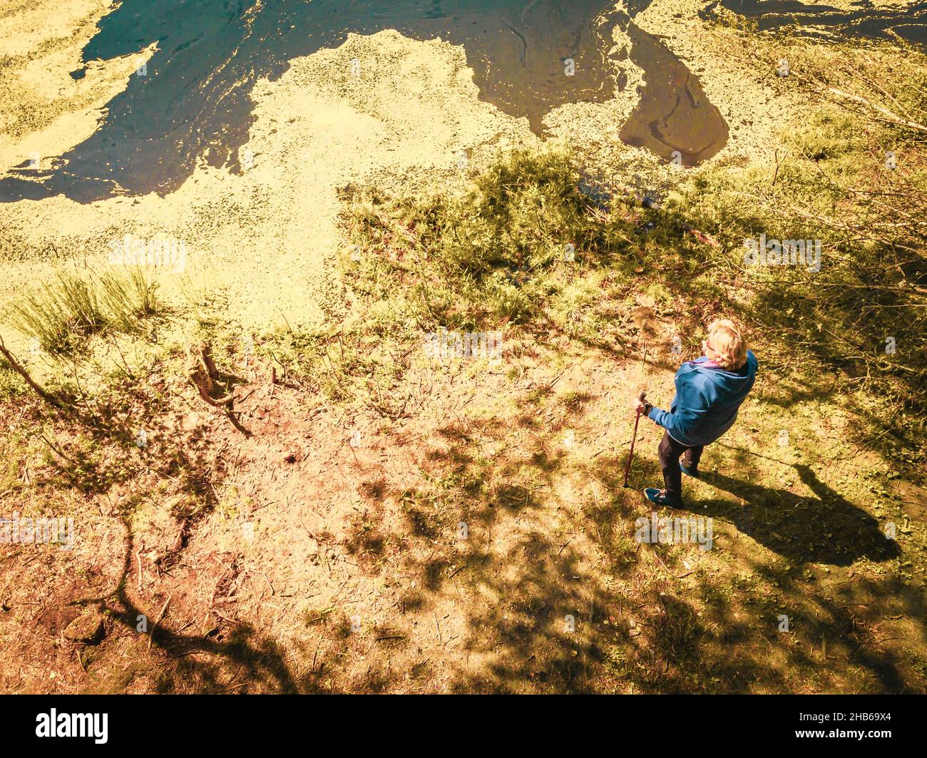 Elderly woman in hoodie holding hi-res stock photography and images - Alamy