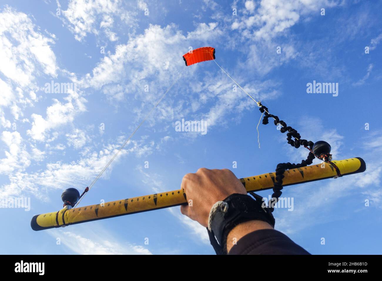 Hand holding a kite on the beach of Blouberg, Cape Town, South Africa Stock Photo