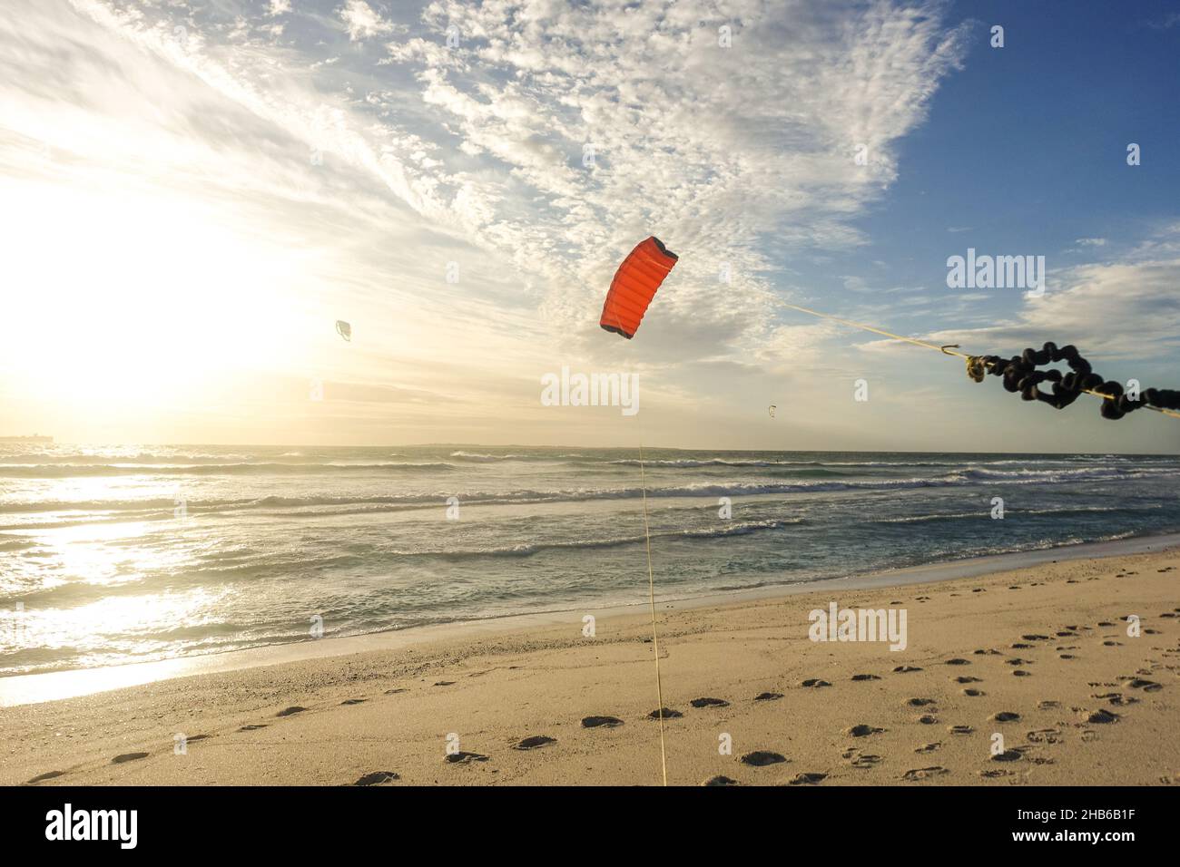 Hand holding a kite on the beach of Blouberg, Cape Town, South Africa Stock Photo