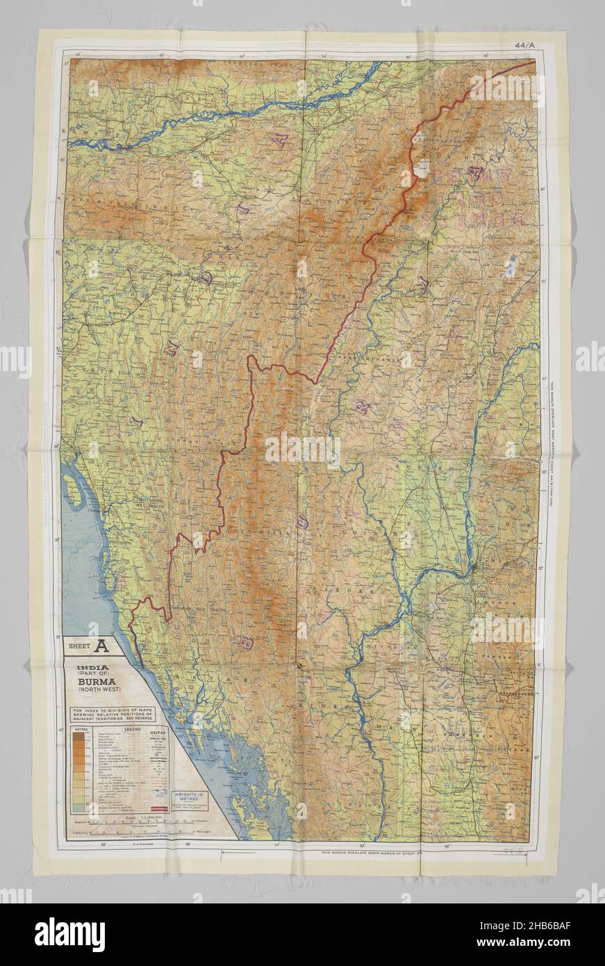 Silk map used as a pilot's scarf, Silk map from the British Air Force (RAF). The fabric is printed on both sides with the maps, 44 A and 44 B of Burma, part of French Indo China, part of Siam, now Thailand, part of India and part of China. The silk maps were intended for pilots and crew members of the RAF. The material made them light, resistant to water and the humid climate in general. This housecoat was made in Indonesia by Mrs Terwen de Loos from silk maps which were popular for making clothes after the liberation due to the textile shortage. This additional donation gives a good idea of Stock Photo
