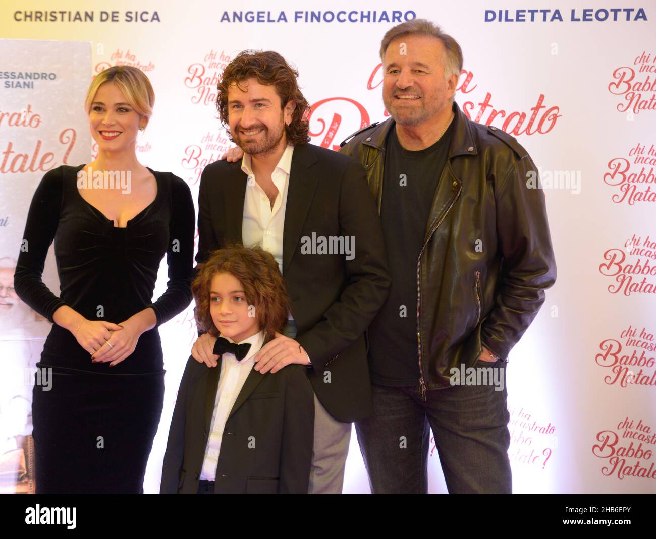 Alessandro Siani, Christian De Sica, Diletta Leotta and Martin Francisco Montero pose during a photocall for the Christmas film in Naples, Italy Stock Photo