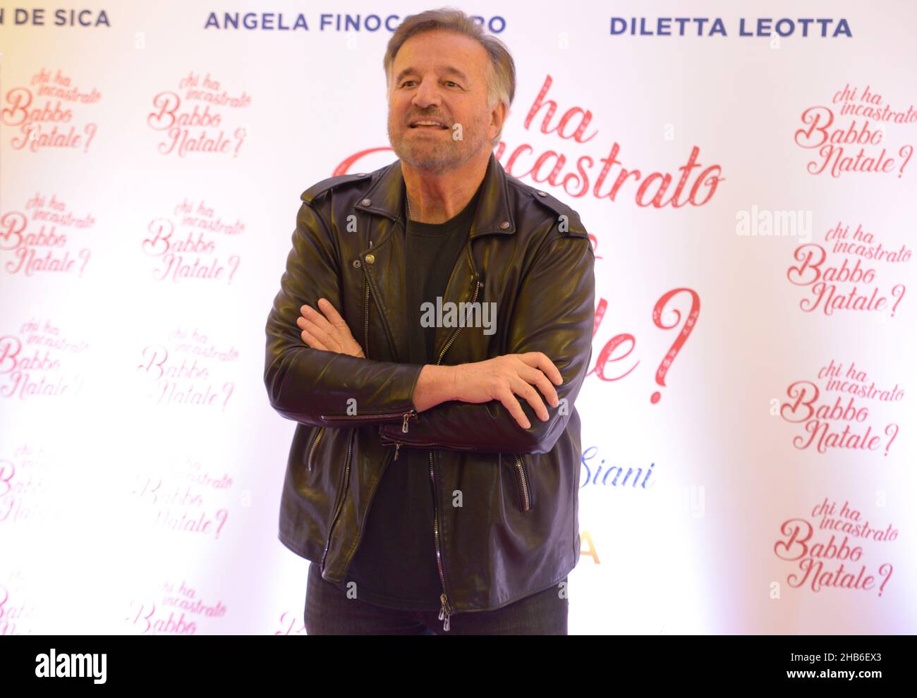 Christian De Sica pose during a photocall session for the Christmas film 'Chi ha incastrato Babbo Natale?' in Naples, Italy Stock Photo