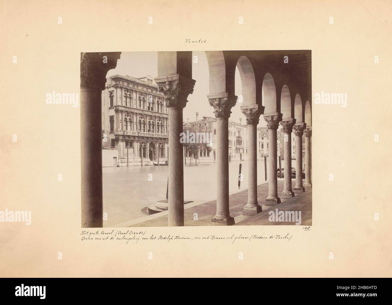 View of the Grand Canal from the colonnade of Fondaco dei Turchi at Venice, Venice. The Grand Canal. ( Canal Grande.) Seen from the colonnade of the Municipal Museum, an ancient Romanesque building. (Fóndaco de'Turchi.). (title on object), anonymous, Venice, c. 1875 - c. 1900, cardboard, albumen print, height 183 mm × width 241 mm Stock Photo