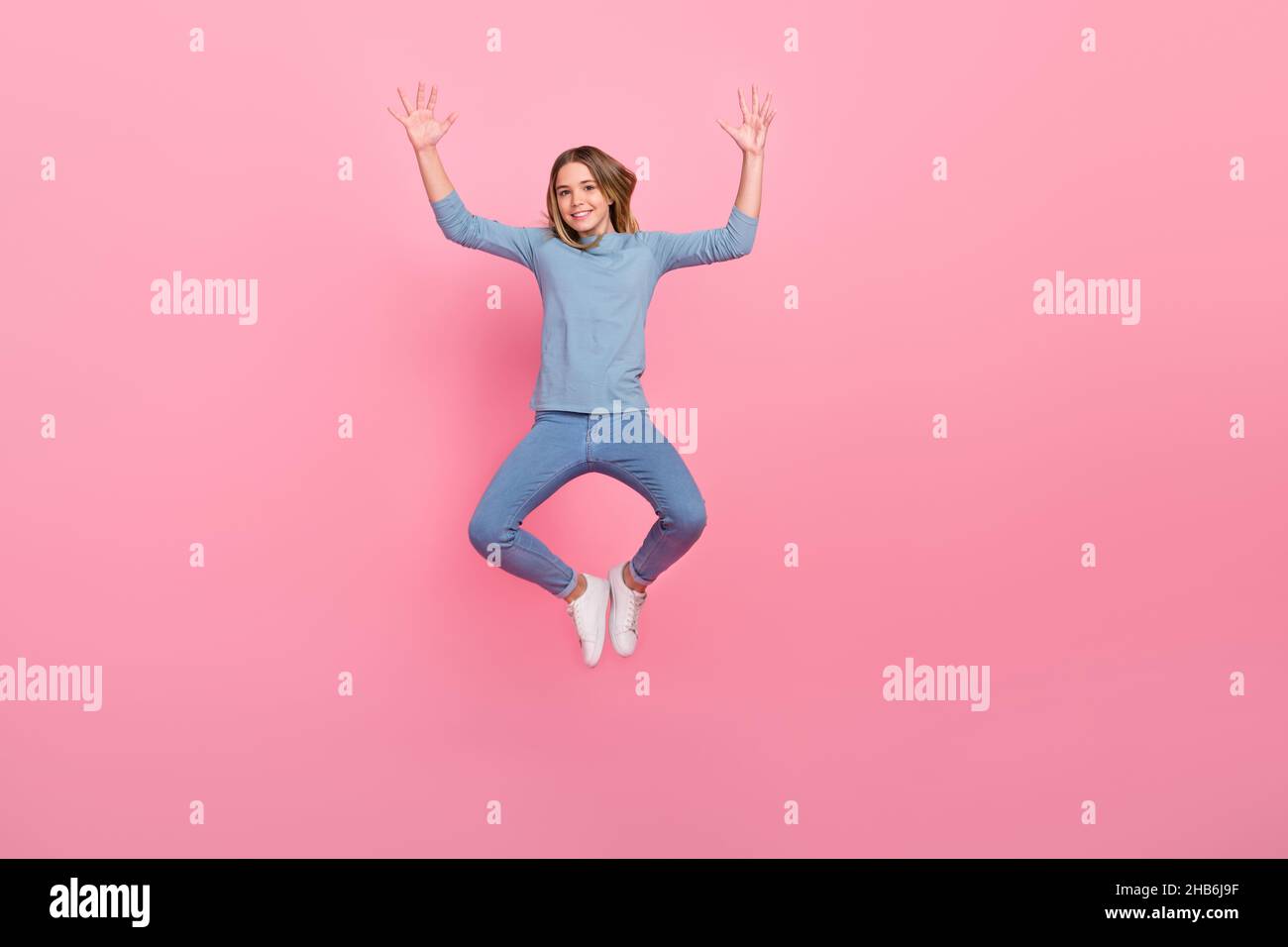 Full size photo of young cheerful lady have fun jumper show palms