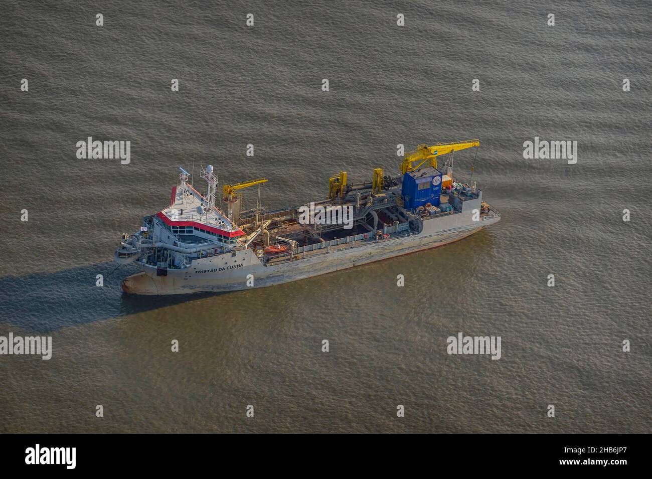 Dredger MS TRISTAO DA CUNHA waiting at anchor on the river Elbe, aerial view, Germany, Schleswig-Holstein, Hamburgisches Wattenmeer National Park Stock Photo
