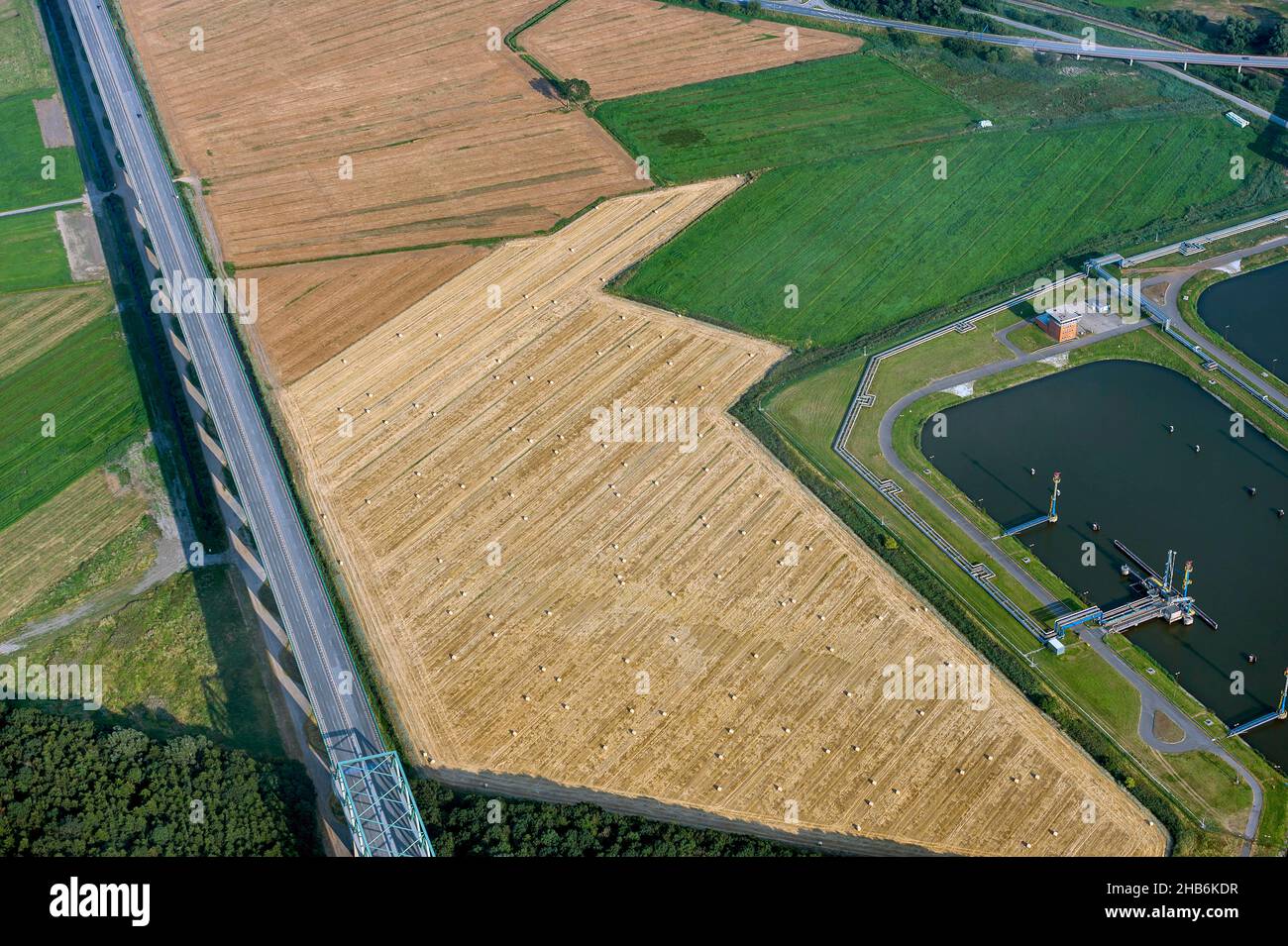 federal road B 5 to the high bridge Brunsbuettel over the Kiel Canal in field landscape, aerial view, Germany, Schleswig-Holstein, Brunsbuettel Stock Photo