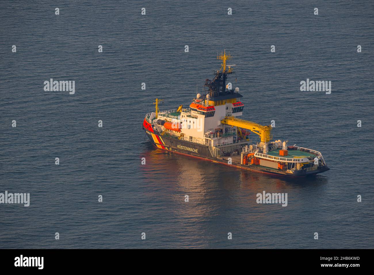 Ship MS Neuwerk of the German Coast Guard lies at anchor in the Elbe estuary, aerial view, Germany, Hamburgisches Wattenmeer National Park Stock Photo