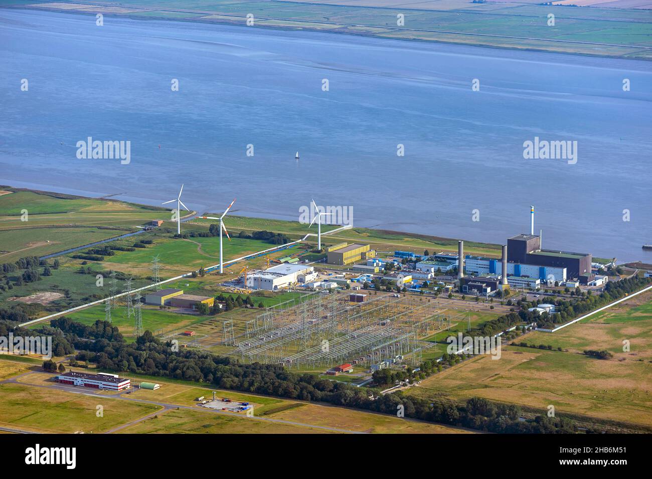 Brunsbuettel nuclear power plant with substation and industry on the Elbe, aerial view, Germany, Schleswig-Holstein, Brunsbuettel Stock Photo