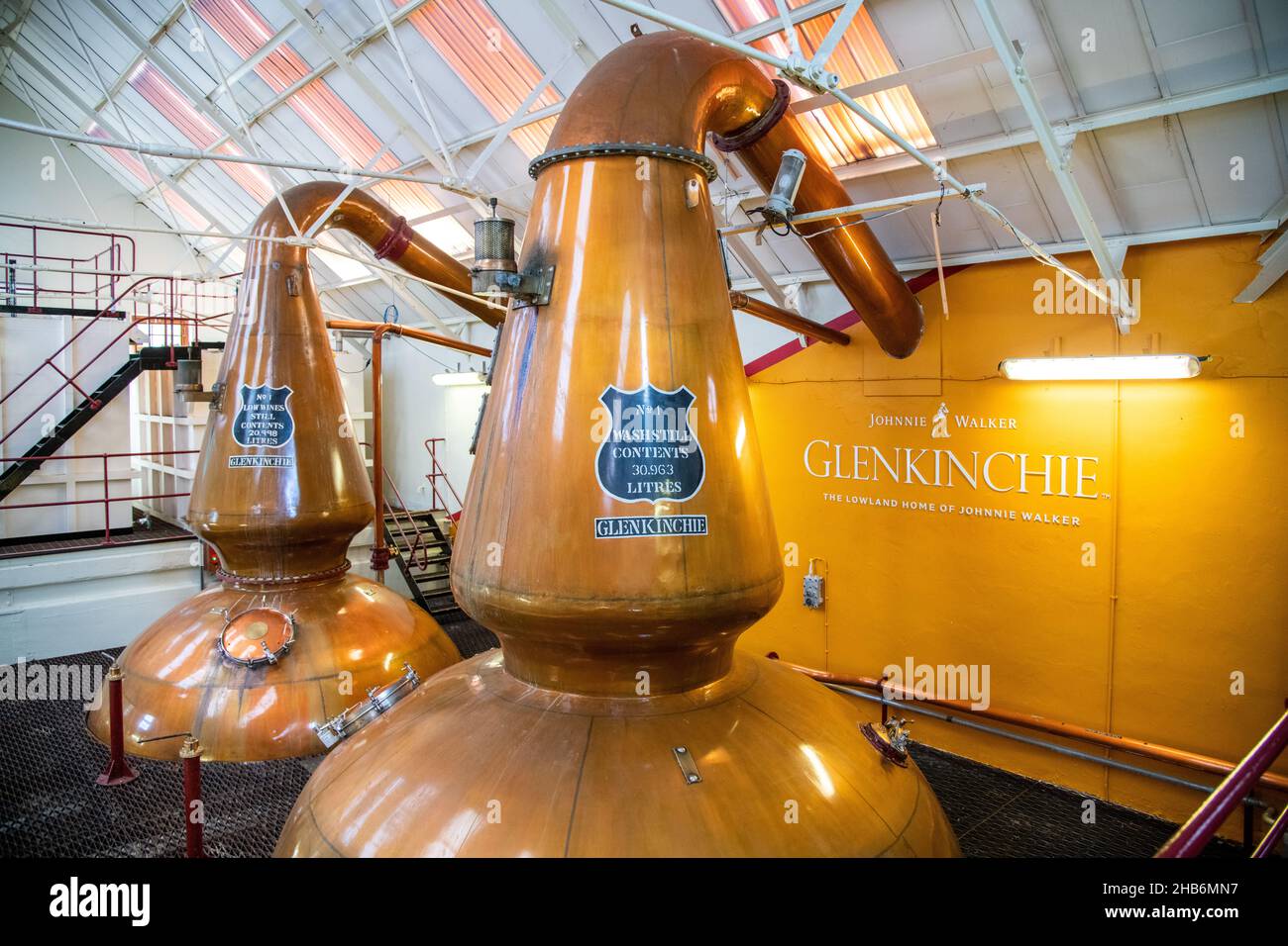 Two pot stills for distilling the whisky at the Glenkinchie Whisky Distillery in East Lothian, Scotland, UK Stock Photo
