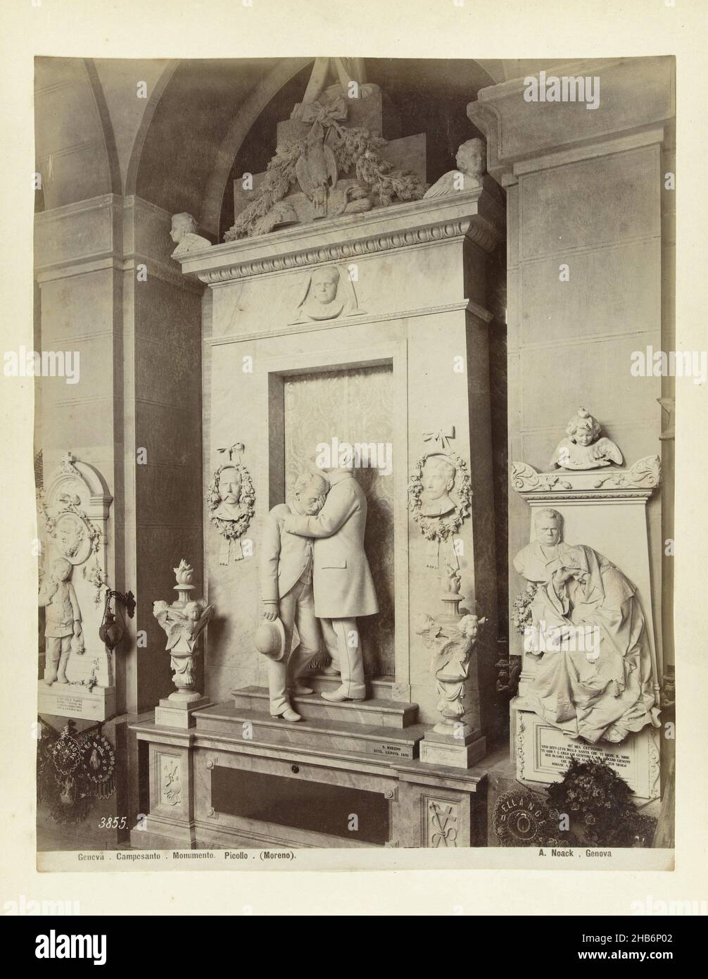 Tomb monument in marble topped with a statue of a man comforting another man3855. Genova Camposanto Monumento Picollo (Moreno) A. Noack, Genova. (title on object), Alfredo Noack (mentioned on object), Genua, c. 1881 - c. 1900, photographic support, albumen print, height 260 mm × width 207 mmheight 277 mm × width 367 mm Stock Photo