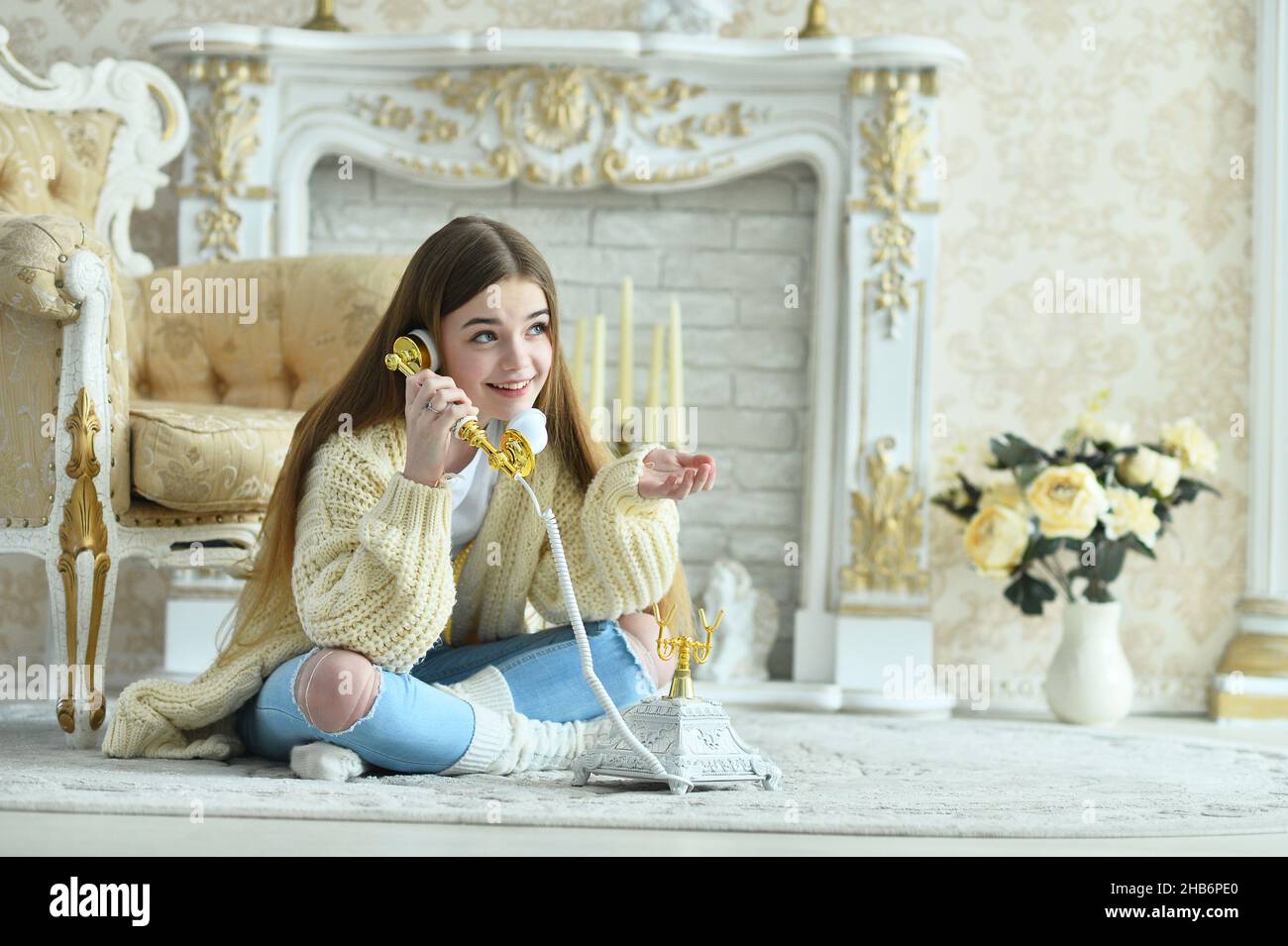 Portrait of beautiful teen girl sitting on floor Stock Photo - Alamy