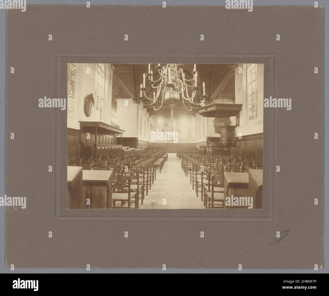 Interior of the Dutch Reformed Church in De Rijp, North Holland, Interior of the Dutch Reformed Church in De Rijp, North Holland. Wooden ceiling, two large chandeliers and chairs., Leonard Vlaanderen (mentioned on object), Alkmaar, 1923, photographic support, cardboard, gelatin silver print, height 167 mm, width 225 mmheight 299 mm, width 361 mm Stock Photo