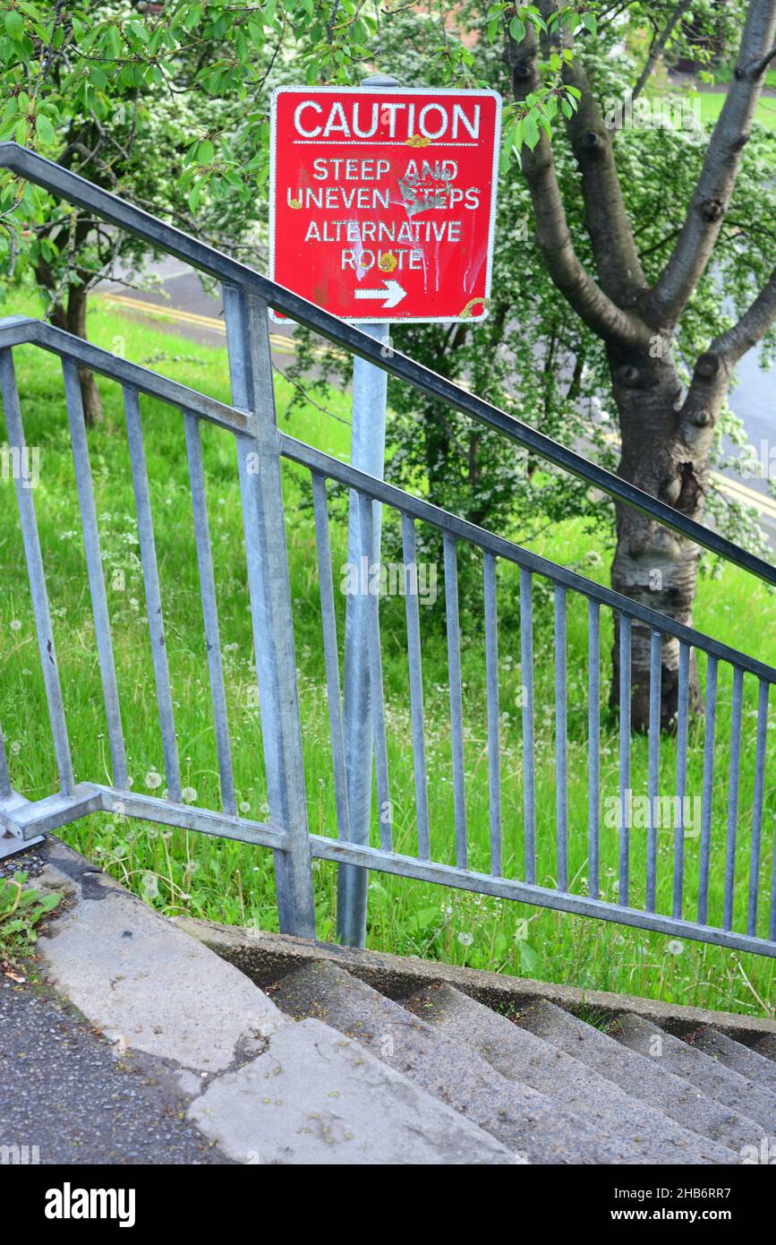 caution warning sign of steep and uneven steps united kingdom Stock Photo