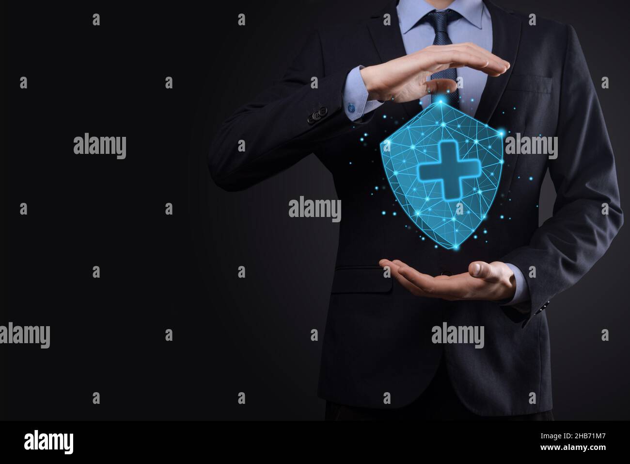 Businessman hold Shield with plus Low polygonal icon, medicine icon ...