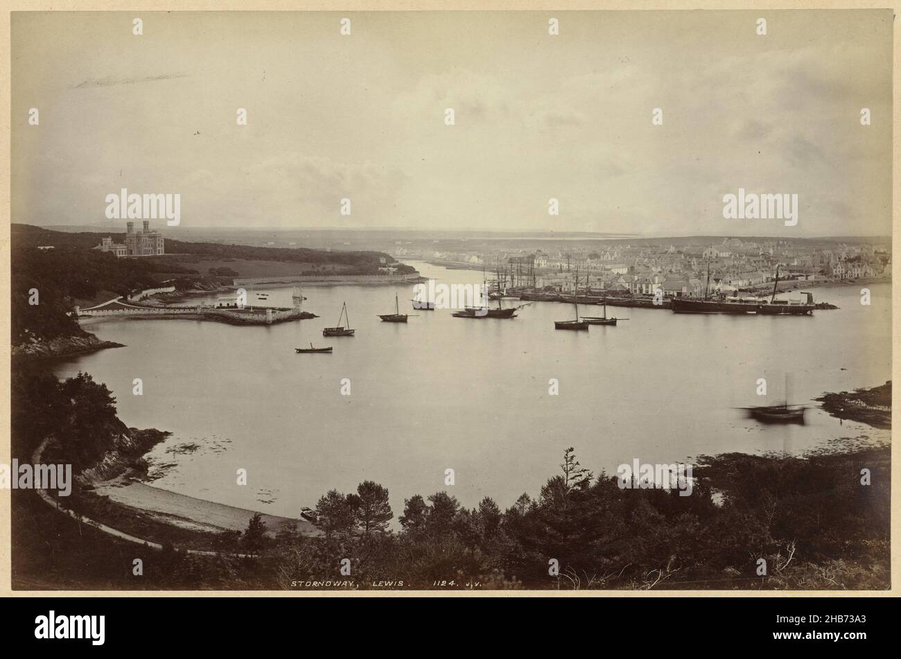 View of Stornoway, Lewis, with Lews Castle on the left, Stornoway, Lewis (title on object), James Valentine (mentioned on object), Lewis, 1851 - 1880, paper, cardboard, albumen print, height 190 mm × width 290 mmheight 244 mm × width 363 mm Stock Photo