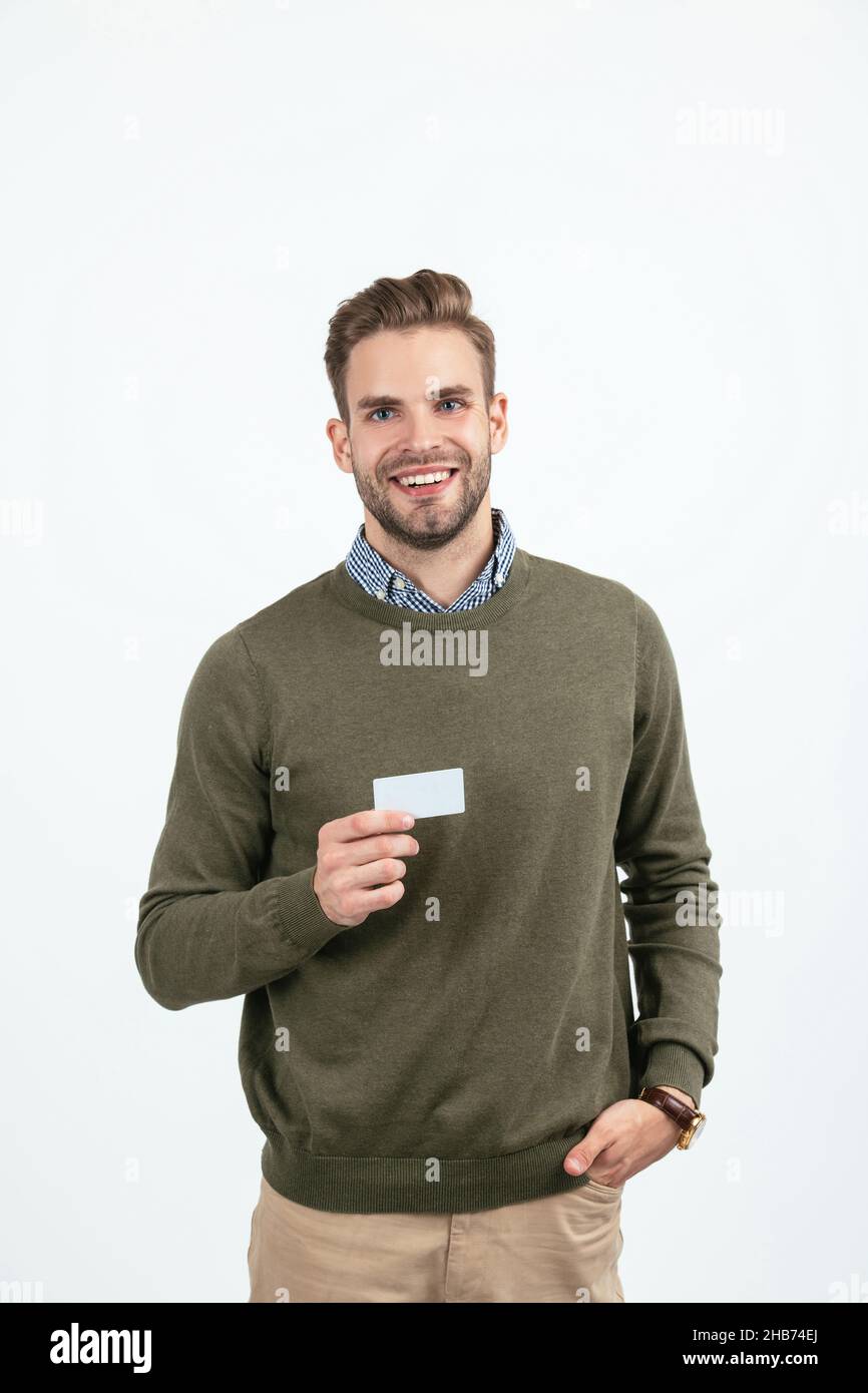 handsome man with stylish hair showing business card isolated on white, copy space, business Stock Photo