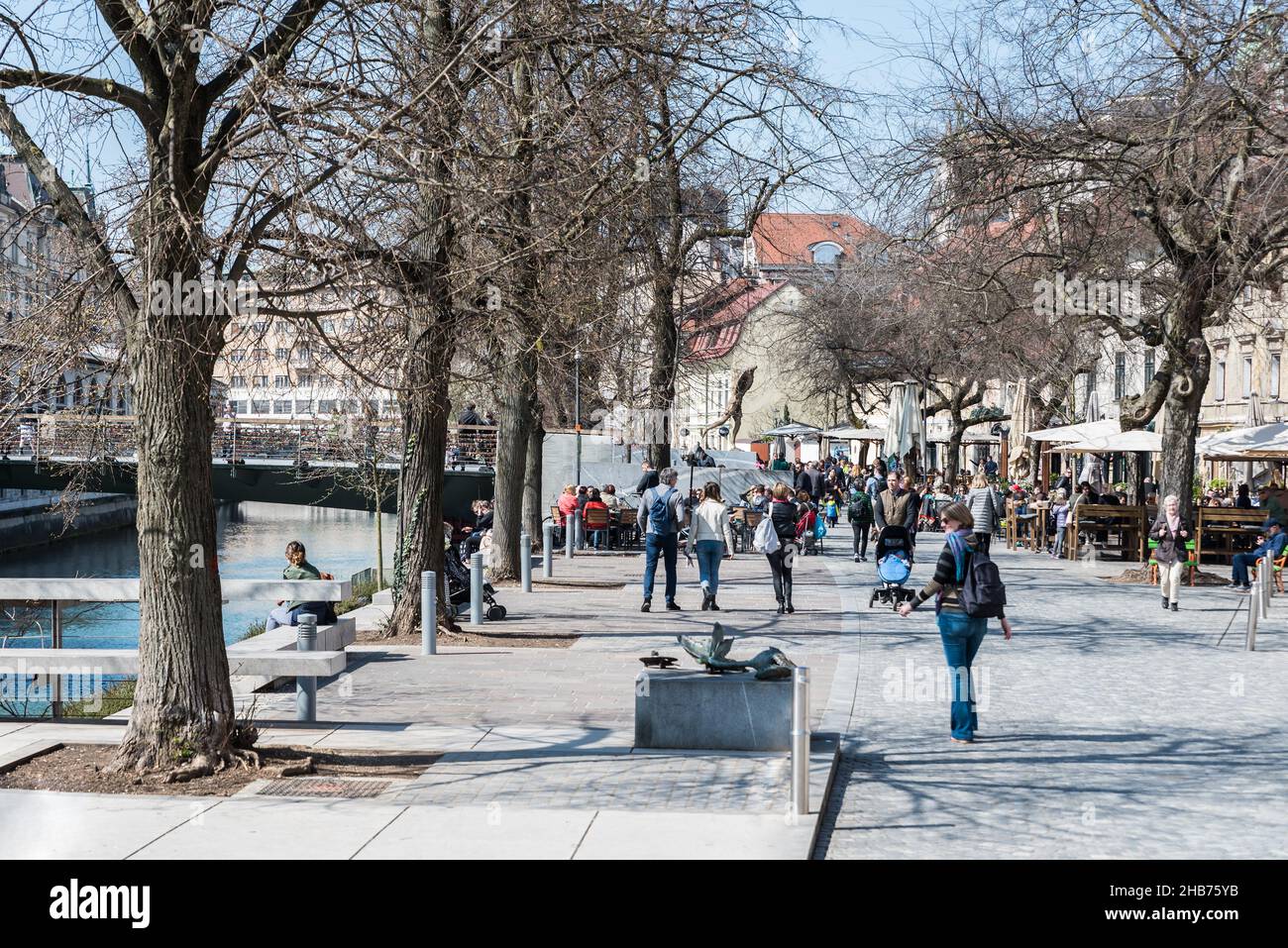 Ljubljana, Slovenia - 04 07 2018: People walking in the streets of old town near the dragon bridge Stock Photo