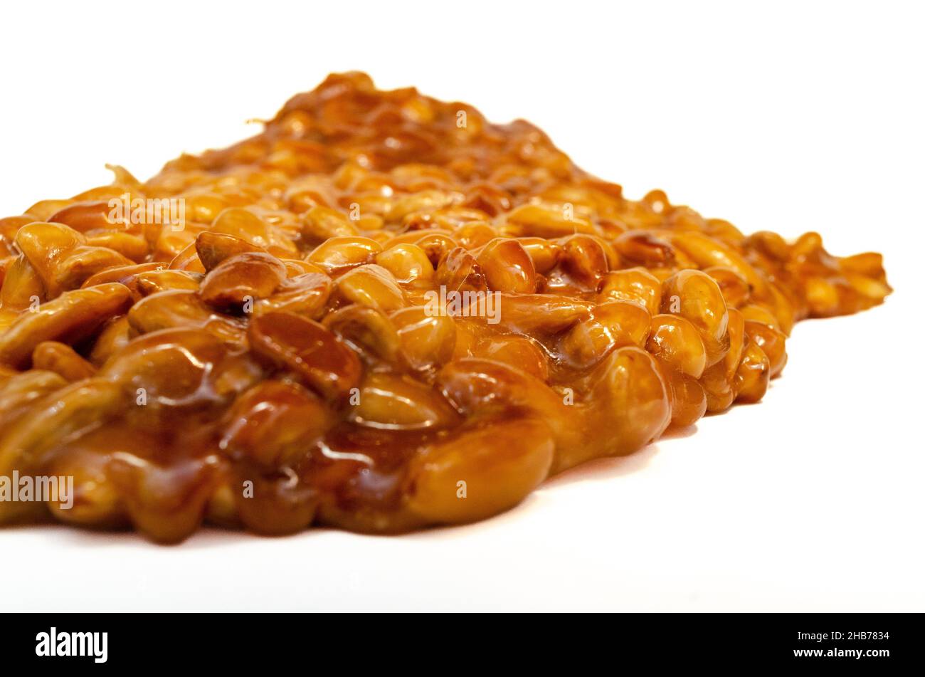 almonds caramelized prepare on restaurant kitchen isolate on white Stock Photo