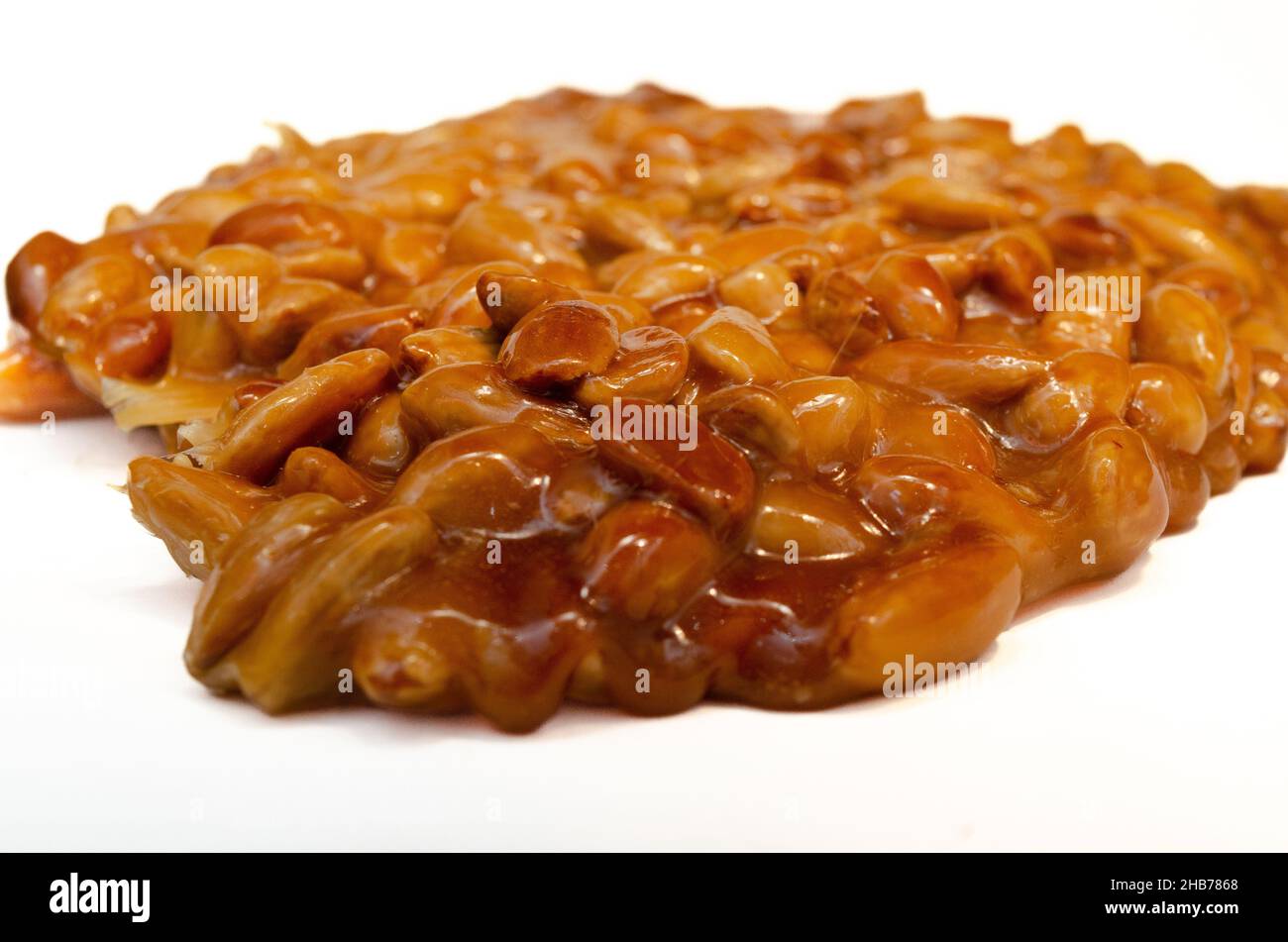 almonds caramelized prepare on restaurant kitchen isolate on white Stock Photo