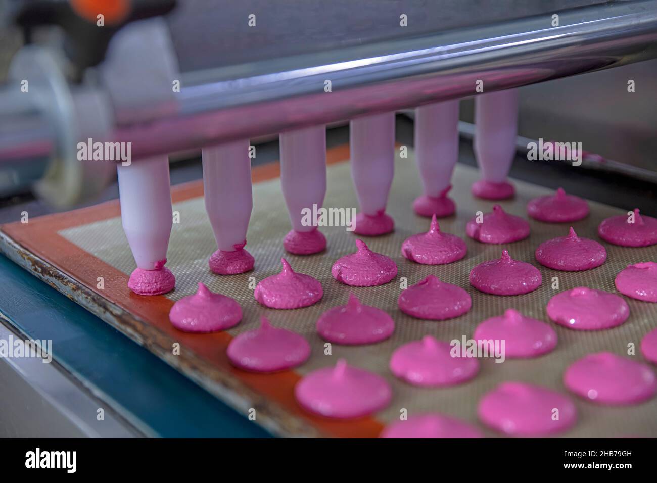 Production of macarons. Preparation of pink dough. Pink Buttercream