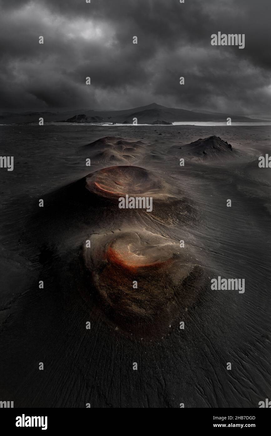 Aerial Capture Of Volcanic Craters Lined Up In A Black Icelandic ...