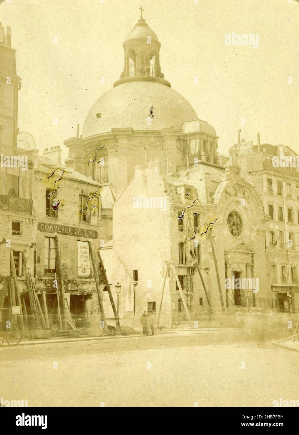 Destruction around the Temple du Marais by the Paris Commune, Destructions de la Commune, Eglise Ste Marie (original title), Like stereotissues, this photograph was made to be viewed in transmitted light. This allows color effects and the suggestion of flames to be seen., Eugène Hanau (mentioned on object), Paris, 1871, cardboard, paper, albumen print, cutting, height 178 mm × width 140 mmheight 142 mm × width 107 mm Stock Photo