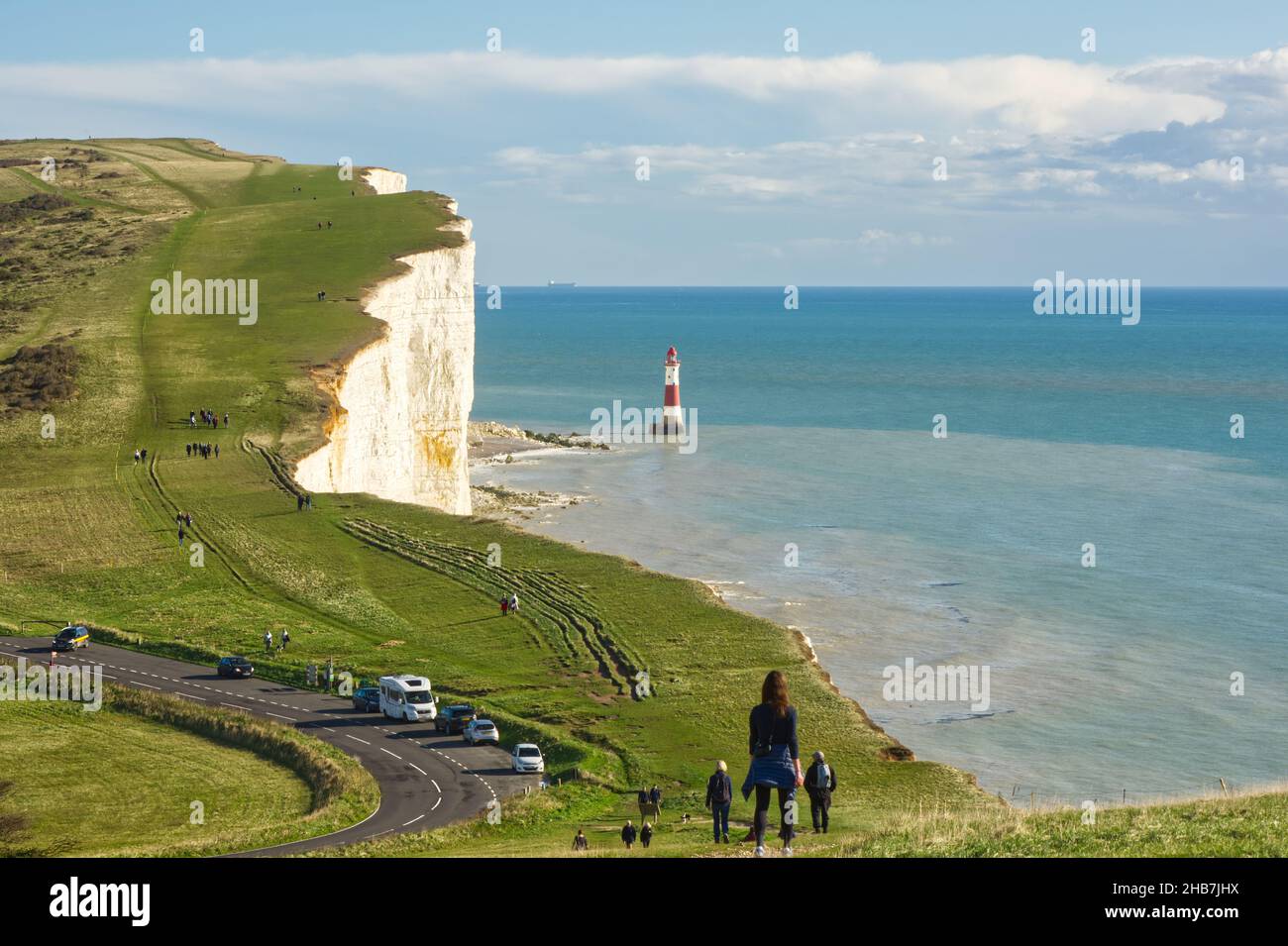 View to Beachy Head on the South Downs near Eastbourne in East Sussex, England. With people walking and sightseeing Stock Photo